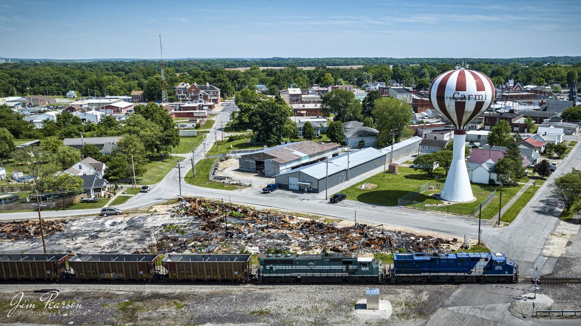 SavaTrans (SVTX) 1982 and Evansville Western Railway 4519 head north through downtown Carmi, Illinois on May 22nd, 2023, with an empty coal train. The Chris Cline Group are owners of the company Savatrans which purchased three ES44AC locomotives numbered to represent the Penn State Championship football years # 1912, 1982, & 1986. The railroad operates from Sugar Camp Mine in Akin, IL to Abee, IN near Mount Vernon/West Franklin, IN area.

Tech Info: DJI Mavic 3 Classic Drone, RAW, 24mm, f/2.8, 2000, ISO 100.

#trainphotography #railroadphotography #trains #railways #dronephotography #trainphotographer #railroadphotographer #jimpearsonphotography #trains #savatrans #evwrrailway #illinoistrains #mavic3classic #drones #trainsfromtheair #trainsfromadrone #savatrans #coaltrain