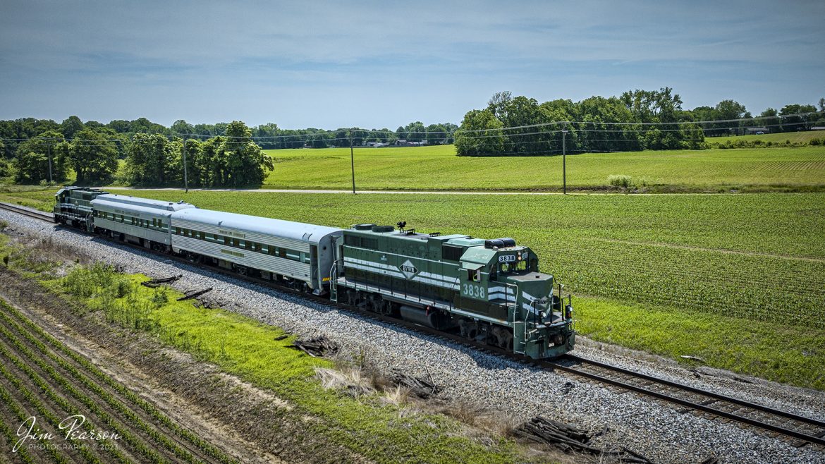 Evansville Western Railway (EVWR) 3838 leads and 3839 trains on EVWR3 headed north out of Mount Vernon, Indiana with an Operation Lifesaver train, carrying local officials, fire and police department chiefs, on May 22nd, 2023. The business cars are from the Paducah and Louisville Railway, which owns the EVWR.

The Evansville Western Railway is a Class III common carrier shortline railroad operating in the southern Illinois and Indiana region. It is one of three regional railroad subsidiaries owned and operated by P&L Transportation. The other company is the Appalachian and Ohio Railroad, located in West Virginia.

Tech Info: DJI Mavic 3 Classic Drone, RAW, 24mm, f/2.8, 1/3200, ISO 120.

#trainphotography #railroadphotography #trains #railways #dronephotography #trainphotographer #railroadphotographer #jimpearsonphotography #CSXtrains #mavic3classic #drones #trainsfromtheair #trainsfromadrone #EVWR #evansvillewesternrailway #trainsfromtheair