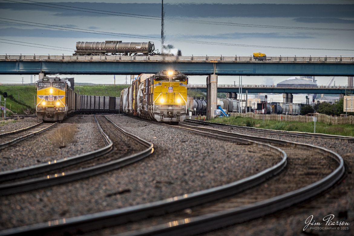 Two eastbound Union Pacific trains move slowly just west of the yard at Cheyenne, Wyoming, on the Laramie Subdivision on the early morning of March 18th, 2023.

Tech Info: Nikon D800, RAW, Sigma 150-600 @500mm, f/5.6, 1/500, ISO 320.

#trainphotography #railroadphotography #trains #railways #dronephotography #trainphotographer #railroadphotographer #jimpearsonphotography #UPtrains #NikonD800 #UnionPacific #WyomingTrains