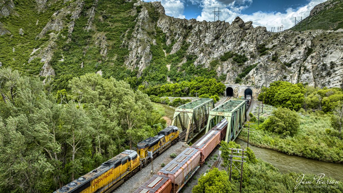 Union Pacific 8794 leads a westbound mixed freight as it meets an eastbound at one of the many bridges and tunnels on the Evanston Subdivision, around Morgan, Utah, on June 19th, 2023.

Tech Info: DJI Mavic 3 Classic Drone, RAW, 24mm, f/2.8, 1/1250, ISO 210.

#trainphotography #railroadphotography #trains #railways #dronephotography #trainphotographer #railroadphotographer #jimpearsonphotography #trains #unionpacific #mavic3classic #drones #trainsfromtheair #trainsfromadrone #UtahTrains