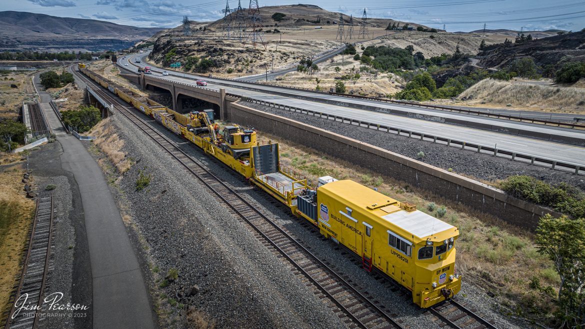 This is the reverse view during our run to Seattle, Washington of the Union Pacific work train I caught from my recent trip and the only Union Pacific train I caught on this day was this Maintenance of Way train at The Dalles in Oregon. They were busy picking up ties on the Portland Subdivision, by The Dalles Dam, on June 20th, 2023, with UP 958200 leading the trainset and this view is from the rear of the train with UP 959201.

If you didnt see yesterdays photo you can find it on all my social media sites and website.

From what I can find online Union Pacific took delivery of the RELCO built MofW work train set #958200 in July 2019. The set is made up of special flats/gons and a rebuilt SD-40-2 locomotive (former number unknown). The trailing unit was numbered UP 958201.

Tech Info: DJI Mavic 3 Classic Drone, RAW, 24mm, f/2.8, 1/2000, ISO 140.

#trainphotography #railroadphotography #trains #railways #dronephotography #trainphotographer #railroadphotographer #jimpearsonphotography #trains #mavic3classic #drones #trainsfromtheair #trainsfromadrone #UnionPacific #MOWtrainset #oregontrains