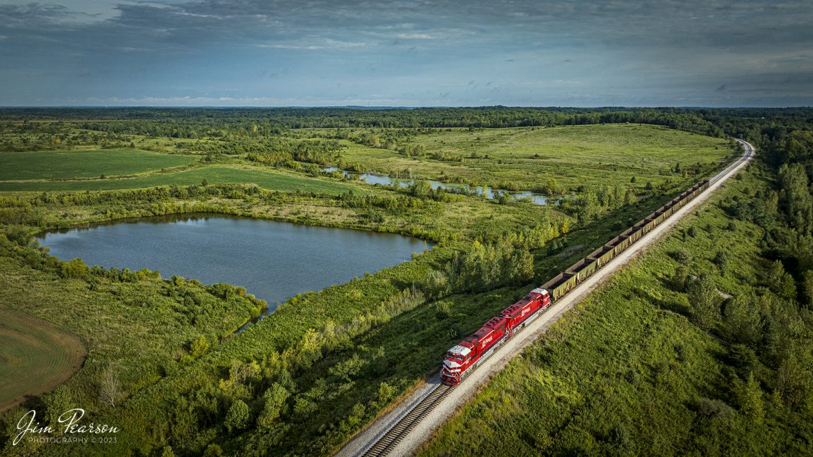 A short Indiana Railroad (INRD) 14 car empty coal train, EHWBR (Empty Hiawatha to Bear Run) heads along the lead to Bear Run Mine to pick up a load of coal at Dugger, Indiana, on the morning of August 26th, 2023, with INRD 7004 and 7003 EMD SD70M as power for their train.

According to Wikipedia: The Indiana Railroad (reporting mark INRD) is a United States Class II railroad, originally operating over former Illinois Central Railroad trackage from Newton, Illinois, to Indianapolis, Indiana, a distance of 155 miles (249 km). This line, now known as the Indiana Rail Roads Indianapolis Subdivision, comprises most of the former IC/ICG line from Indianapolis to Effingham, Illinois; Illinois Central successor Canadian National Railway retains the portion from Newton to Effingham.

The company was formed in 1986 by entrepreneur Thomas Hoback, who retired as president and chief executive officer in 2015. CSX Transportation now owns a majority interest in the parent company. The company's executive and administrative offices are in downtown Indianapolis, Indiana.


Tech Info: DJI Mavic 3 Classic Drone, RAW, 24mm, f/2.8, 1/1600, ISO 120.

#trainphotography #railroadphotography #trains #railways #dronephotography #trainphotographer #railroadphotographer #jimpearsonphotography #trains #mavic3classic #drones #trainsfromtheair #trainsfromadrone #INRD #ISRR #Indianatrains #coaltrains