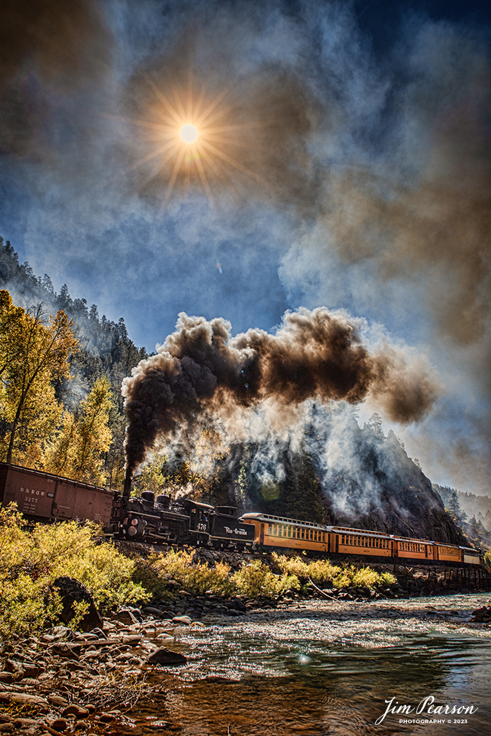 Durango and Silverton Narrow Gauge steam locomotive D&RGW 476 runs as a mid-train helper on a K-28 100th Anniversary Special as they head through through the Repeating Curves at MP 472.2, along the Animas River, between Durango and Silverton, Colorado, on October 16th, 2023.

According to Wikipedia: The Durango and Silverton Narrow Gauge Railroad, often abbreviated as the D&SNG, is a 3 ft (914 mm) narrow-gauge heritage railroad that operates on 45.2 mi (72.7 km) of track between Durango and Silverton, in the U.S. state of Colorado. The railway is a federally designated National Historic Landmark and was also designated by the American Society of Civil Engineers as a National Historic Civil Engineering Landmark in 1968.

Tech Info: Nikon D810, RAW, Sigma 24-70 @ 24mm, f/5.6, 1/1000, ISO 64.

railroad, railroads train, trains, best photo. sold photo, railway, railway, sold train photos, sold train pictures, steam trains, rail transport, railroad engines, pictures of trains, pictures of railways, best train photograph, best photo, photography of trains, steam, train photography, sold picture, best sold picture, Jim Pearson Photography, Durango and Silverton Narrow Guage Railroad, steam train, drgwrr