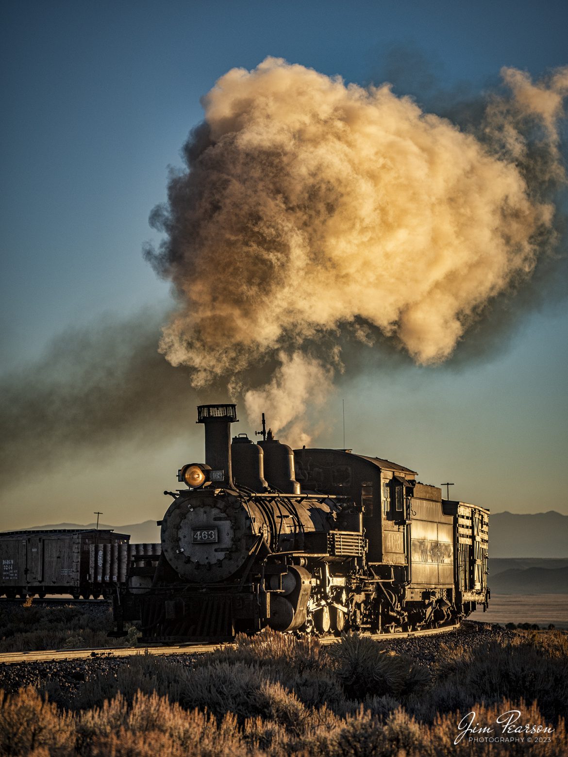 Cumbres & Toltec Scenic Railroad steam locomotive D&RGW 463 as it passes through the curve headed up to the Lava Water Tank at sunrise, between Antonito and Osier, Colorado, during a photo charter by Dak Dillon Photography on October 19th, 2023.

According to their website: the Cumbres & Toltec Scenic Railroad is a National Historic Landmark.  At 64-miles in length, it is the longest, the highest and most authentic steam railroad in North America, traveling through some of the most spectacular scenery in the Rocky Mountain West.

Owned by the states of Colorado and New Mexico, the train crosses state borders 11 times, zigzagging along canyon walls, burrowing through two tunnels, and steaming over 137-foot Cascade Trestle. All trains steam along through deep forests of aspens and evergreens, across high plains filled with wildflowers, and through a rocky gorge of remarkable geologic formations. Deer, antelope, elk, fox, eagles and even bear are frequently spotted on this family friendly, off-the grid adventure.

According to History Colorado Website: Built in 1903 by the Baldwin Locomotive Works of Philadelphia, Engine No. 463 is one of only two remaining locomotives of the K-27 series originally built for and operated by the Denver & Rio Grande Western Railroad.

The K-27 series was a departure from the design most prevalent on Colorado’s narrow-gauge lines, resulting in a locomotive with one and one-half times more power.  The arrival of this series marked a significant turning point in the operation of the D&RGW’s narrow gauge lines that was to remain in effect until the end of Class I narrow gauge steam locomotion in 1968.  The Friends of the Cumbres & Toltec Scenic Railroad restored the engine to operating condition.

Tech Info: Nikon D810, RAW, Nikon 70-300 @112mm, f/8, 1/2000, ISO 160.

#trainphotographer #railroadphotographer #jimpearsonphotography #NikonD810 #digitalphotoart #steamtrain #ColoradoSteamTrain #ctsrr