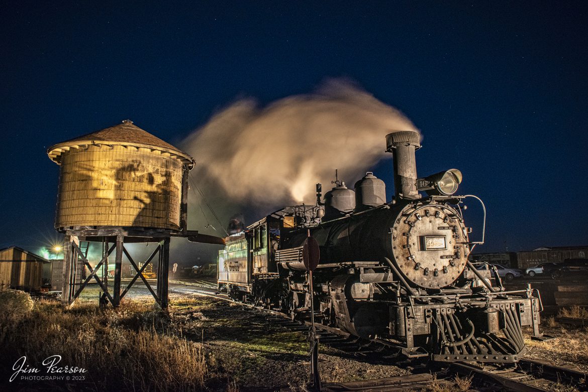 Stars fill the sky on the night of October 19th, 2023, as the crew on D&RGW 463 takes on water at the yards water tank at Antonito, Colorado, during the night photoshoot hosted by Dak Dillion Photography during a two-day photo charter, between Antonito and Osier, CO.

Tech Info: Nikon D810, RAW, Sigma 24-70 @36mm, f/8, 3 seconds, ISO 1400.

#trainphotographyphotoart #photoartrailroadphotography #photoarttrains #photoartrailways #trainphotographer #railroadphotographer #jimpearsonphotography #NikonD800 #digitalphotoart #steamtrain #ColoradoSteamTrain #D&RGW