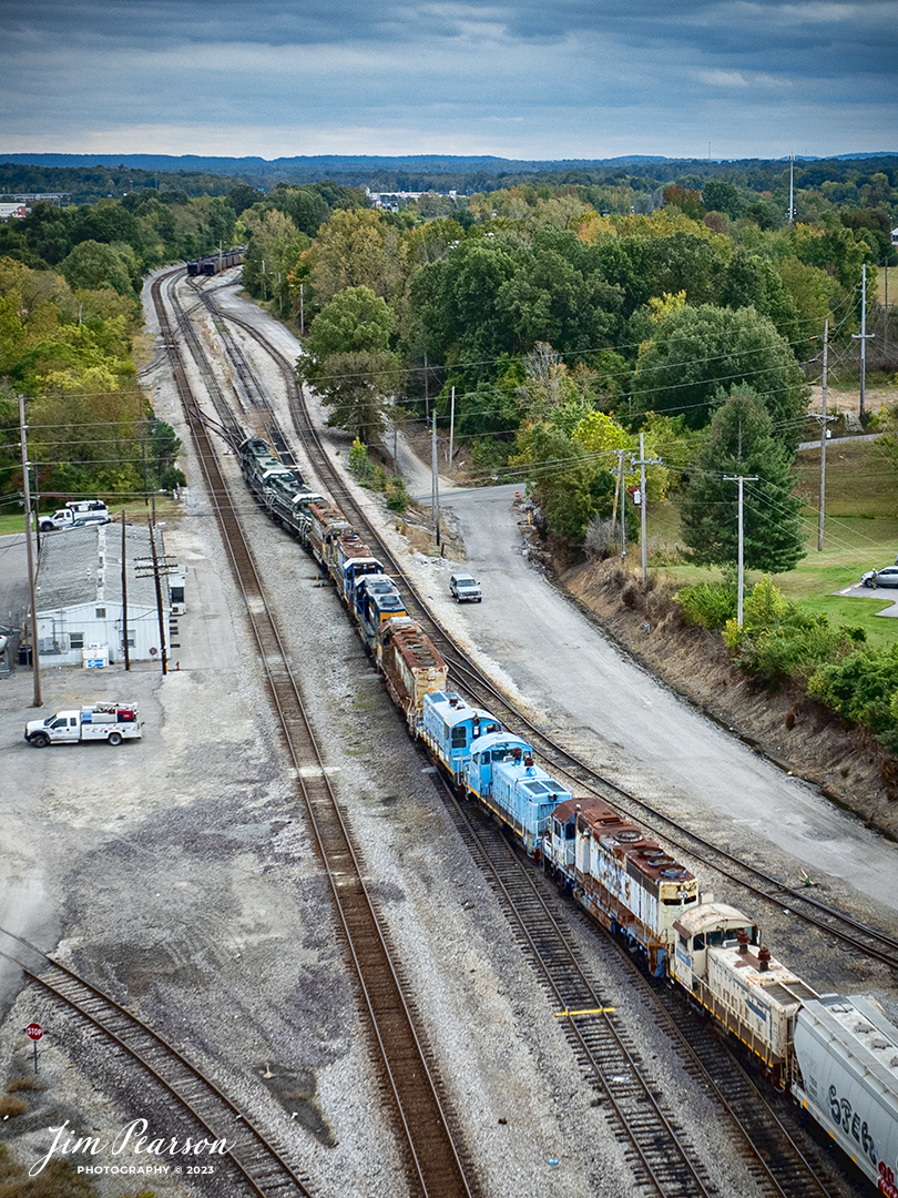 A Paducah and Louisville Local works on dropping off a string of 9 old locomotives at CSX’s Atkison Yard in Madisonville, Kentucky on October 8th, 2023, on the Henderson Subdivision. All the units went south a few days later via CSX. Not sure where they were delivered to. Unfortunately, I never got a good shot where I could identify all the locomotives.

Tech Info: DJI Mavic 3 Classic Drone, RAW, 22mm, f/2.8, 1/1250, ISO 110.

railroad, railroads train, trains, best photo. sold photo, railway, sold train photos, sold train pictures, freight trains, cargo trains, rail transport, railroad engines, pictures of trains, pictures of railways, best photograph, best photo, photography of trains, train photography, sold picture, best sold picture, CSX, CSX railroad, Kentucky trains, Jim Pearson Photography, CSX Henderson subdivision