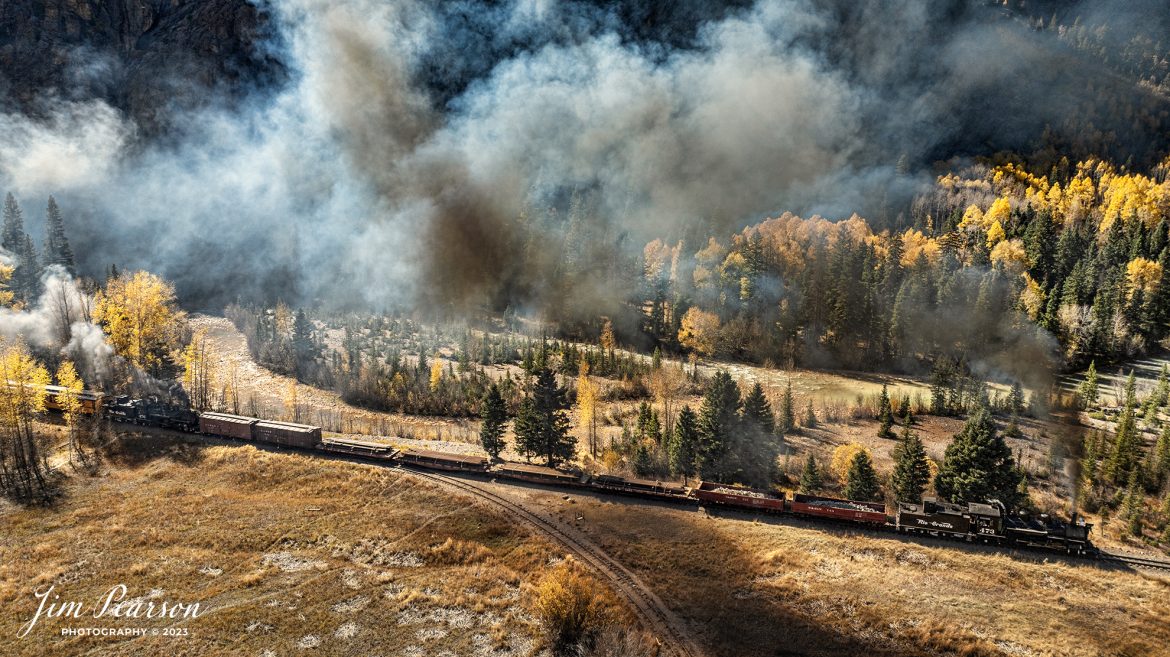 Durango and Silverton Narrow Gauge steam locomotive D&RGW 473 leads a K-28 100th Anniversary Special with D&RGW 476 as a mid-train helper as they pass the wye at Elk Park, on their way to Silverton, Colorado on October 16th, 2023.


According to Wikipedia: The Durango and Silverton Narrow Gauge Railroad, often abbreviated as the D&SNG, is a 3 ft (914 mm) narrow-gauge heritage railroad that operates on 45.2 mi (72.7 km) of track between Durango and Silverton, in the U.S. state of Colorado. The railway is a federally designated National Historic Landmark and was also designated by the American Society of Civil Engineers as a National Historic Civil Engineering Landmark in 1968.

Tech Info: DJI Mavic 3 Classic Drone, RAW, 22mm, f/2.8, 1/800, ISO 100.

#railroad #railroads #train, #trains #bestphoto #soldphoto #railway #railway #soldtrainphotos #steamtrains #railtransport #railroadengines #picturesoftrains #picturesofrailways #besttrainphotograph #bestphoto #photographyoftrains #steamtrainphotography #soldpicture #bestsoldpicture #JimPearsonPhotography #DurangoandSilvertonRailroad