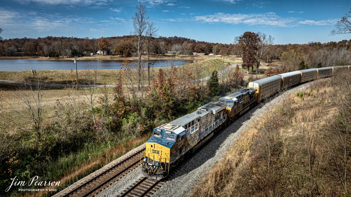 CSXT 1776 Spirit of Our Armed Forces locomotive leads CSX I025 on Veteran’s Day, November 11th, 2023, as it made its way south at Nortonville, Ky, on the CSX Henderson Subdivision. 

According to a press release from CSXT, ES44AH locomotive No. 1776, dubbed “The Spirit of Our Armed Forces,” was unveiled 0n April 30, 2019, at the railroad’s Huntington Heavy Repair shops in West Virginia.

No. 1776, renumbered from No. 3112, wears a combination standard CSX scheme on its cab and a highly detailed digital camouflage paint scheme on its long hood which adorns CSX’s new “Pride in Service” logo. The seals of the five-armed services branches are spread across the rear of the engine’s radiators, and logos for several support organizations for veterans and veterans’ families also appear on the locomotive. A screen-printed American flag covers the side cab windows.

Tech Info: DJI Mavic 3 Classic Drone, RAW, 22mm, f/2.8, 1/2000, ISO 110.

#trainphotography #railroadphotography #trains #railways #jimpearsonphotography #trainphotographer #railroadphotographer #csxt #dronephoto #trainsfromadrone #csxhendersonsubdivision #csxt1776 #nortonvilleky