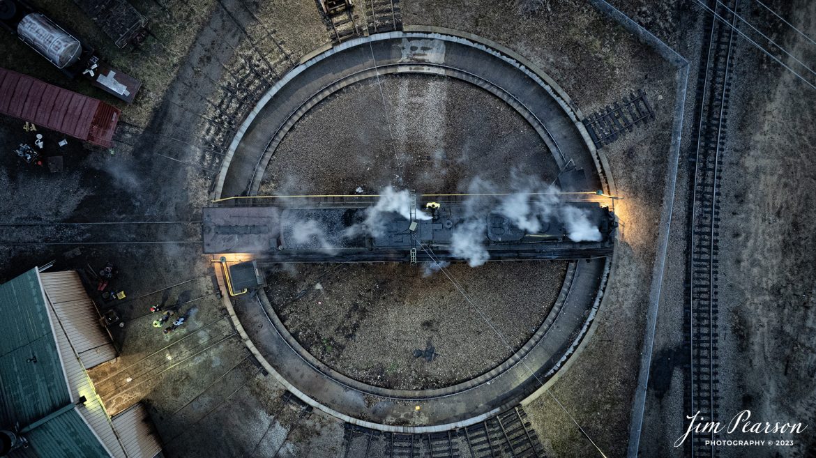 An early morning top-down view of Steam Railroading Institute’s Pere Marquette 1225 as it sits on the turntable at Owosso, Michigan. It was being serviced by crews before it backed up to the ash pit in preparation for another day of pulling the North Pole Express between Owosso and Ashley, Michigan, along the Great Lakes Railroad. 

According to their website, Pere Marquette 1225, the largest and most impressive piece in the Steam Railroading Institute’s collection, is one of the largest operating steam locomotives in Michigan. The 1225 was built in October of 1941 by the Lima Locomotive Works in Lima, Ohio for the Pere Marquette Railway. It’s part of the National Register of Historic Structures and is renowned for its role in the 2004 Warner Brothers Christmas Classic, THE POLAR EXPRESS™. 1225’s blueprints were used as the prototype for the locomotive image as well as its sounds to bring the train in the animated film to life!

Tech Info: Nikon D810, RAW, Sigma 24-70 @ 36mm, f/2.8, 1/10, ISO 600.

#railroad #railroads #train, #trains #railway #railway #steamtrains #railtransport #railroadengines #picturesoftrains #picturesofrailways #besttrainphotograph #bestphoto #photographyoftrains #steamtrainphotography # PereMarquette1225 #bestsoldpicture #JimPearsonPhotography #northpoleexpress #owossomichigan #SteamRailroadingInstitute