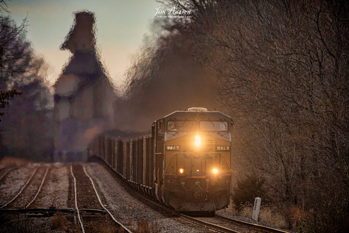 CSXT 776 leads loaded coal train C895, (Gibson county coal (Princeton, IN) - Newport News, VA (for export), north after passing under the steam era coaling temple at Sullivan, Indiana on December 18th, 2023, in the early morning light on the CSX CE&D Subdivision.

Tech Info: Nikon D810, RAW, Sigma 150-600 @ 480mm, f/6, 1/500, ISO 280.

#trainphotography #railroadphotography #trains #railways #trainphotographer #railroadphotographer #jimpearsonphotography #NikonD810 #KentuckyTrains #CSXCEDSubdivision #csxt