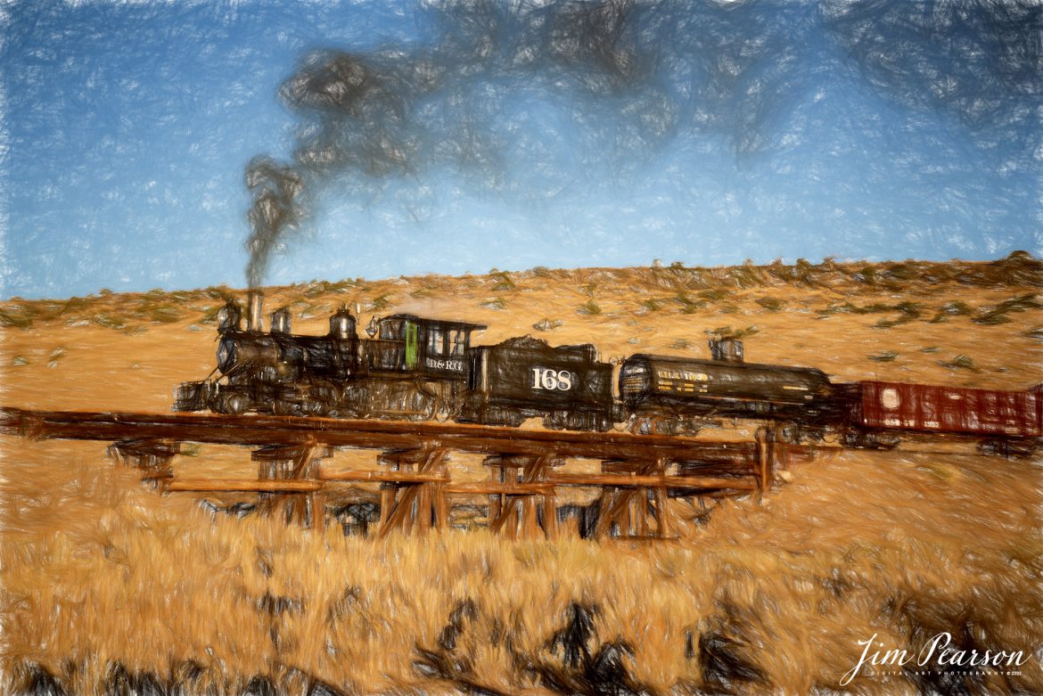 Digital Photo Art – Cumbres & Toltec Scenic Railroad steam locomotive D&RGW 168 passes over Ferguson's Trestle at MP 285.87 at sunrise as it heads to Osier, Colorado, during a photo charter by Dak Dillon Photography on October 20th, 2023.

According to their website: the Cumbres & Toltec Scenic Railroad is a National Historic Landmark.  At 64-miles in length, it is the longest, the highest and most authentic steam railroad in North America, traveling through some of the most spectacular scenery in the Rocky Mountain West.

Owned by the states of Colorado and New Mexico, the train crosses state borders 11 times, zigzagging along canyon walls, burrowing through two tunnels, and steaming over 137-foot Cascade Trestle. All trains steam along through deep forests of aspens and evergreens, across high plains filled with wildflowers, and through a rocky gorge of remarkable geologic formations. Deer, antelope, elk, fox, eagles and even bear are frequently spotted on this family friendly, off-the grid adventure.

Tech Info: Nikon D810, RAW, Sigma 24-70 @ 24mm, f/3.2, 1/1000, ISO 80.

railroad, railroads train, trains, best photo. sold photo, railway, railway, sold train photos, sold train pictures, steam trains, rail transport, railroad engines, pictures of trains, pictures of railways, best train photograph, best photo, photography of trains, steam, train photography, sold picture, best sold picture, Jim Pearson Photography, Cumbres & Toltec Scenic Railroad