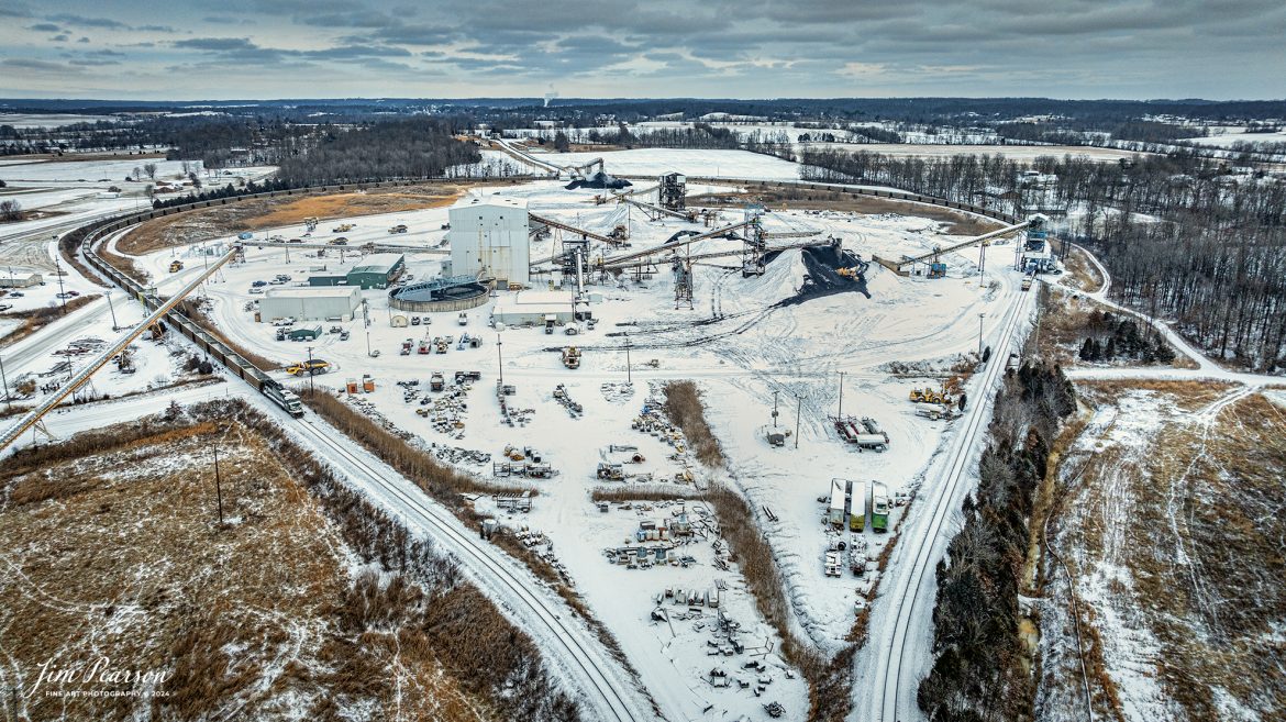 Paducah and Louisville (PAL) 2013 and 4505, on far right, pull through the loading facility at Warrior Coal mine on a snowy cold morning as they begin to load their empty coal train on January 15th, 2024, between Madisonville and Nebo, Kentucky. Once loaded this train will move north on the PAL to deliver their load to Louisville Gas and Electric power plant, outside of Louisville, Ky. PAL 2013 is painted in the University of Louisville colors to honor their different NCAA wins.

Tech Info: DJI Mavic 3 Classic Drone, RAW, 22mm, f/2.8, 1/1250, ISO 100.

#trainphotography #railroadphotography #trains #railways #jimpearsonphotography #trainphotographer #railroadphotographer #csxt #dronephoto #trainsfromadrone #paducahandlouisvillerailroad #trending