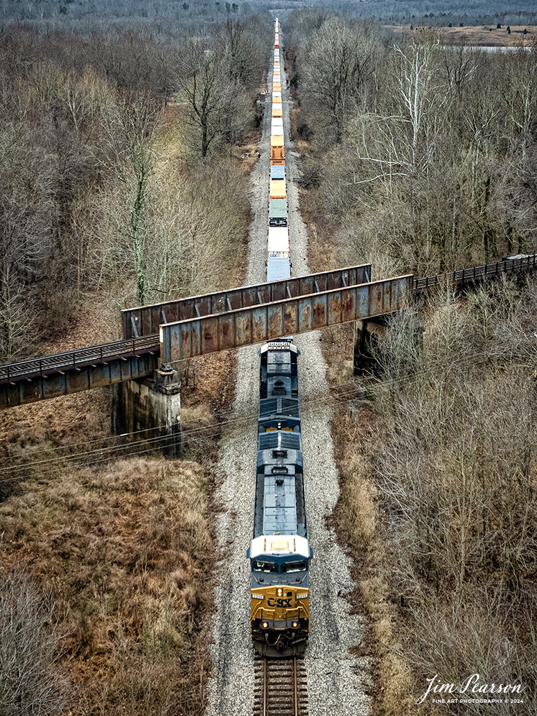 CSX hot intermodal I026 passes under the Paducah and Louisville Railway (PAL) on the Henderson Subdivision as it heads north at the location called Monarch in Madisonville, Ky on January 29th, 2024. 

I’ve been trying for a long time to catch an over/under shot at this location and today I thought I had it, but the PAL train was a bit short today and the CSX train got at this spot about 2 minutes after he had passed. It’ll happen someday!! 

Tech Info: DJI Mavic 3 Classic Drone, RAW, 22mm, f/8, 1/1250, ISO 270.

#trainphotography #railroadphotography #trains #railways #jimpearsonphotography #trainphotographer #railroadphotographer #dronephoto #trainsfromadrone #CSX #trending