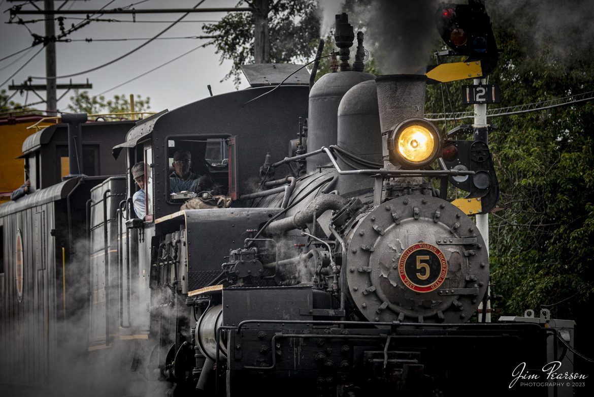 J. Neils Lumber Company Shay number 5 pulls out of the station at the Illinois Railway Museum (IRM) with a caboose train on September 16th, 2023, during the museum’s 70th anniversary celebration weekend at Union, Illinois.

According to the IRM Website: J. Neils Lumber Company 5 is the museum’s only geared locomotive. It is a Shay, designed with three cylinders mounted vertically on the engineer’s side that power a drive shaft running the length of the engine alongside the wheels. This allows all wheels to be powered using bevel gears. Shays were extremely slow but were powerful and could negotiate uneven track and sharp curves, making them popular with logging and mining companies.

Tech Info: Nikon D800, Nikon 70-300 @ 135mm, f/4.6 1/1250, ISO 500.

#trainphotography #railroadphotography #trains #railways #trainphotographer #railroadphotographer #jimpearsonphotography #PassengerTrain #IllinoisRailwayMuseum #IllinoisTrains #steamtrain