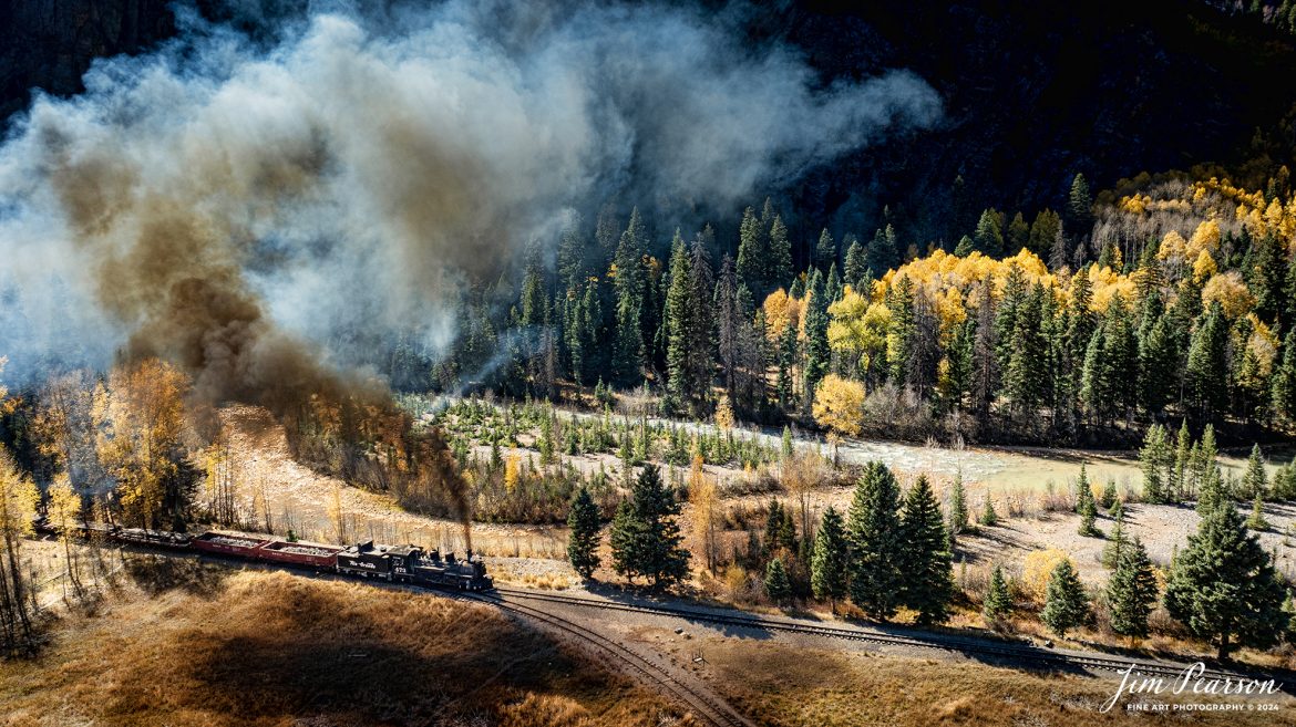 Durango and Silverton Narrow Gauge steam locomotive D&RGW 473 leads a K-28 100th Anniversary Special with a freight consist as they pass the wye at Elk Park, on their way to Silverton, Colorado on October 16th, 2023.

According to Wikipedia: The Durango and Silverton Narrow Gauge Railroad, often abbreviated as the D&SNG, is a 3 ft (914 mm) narrow-gauge heritage railroad that operates on 45.2 mi (72.7 km) of track between Durango and Silverton, in the U.S. state of Colorado. The railway is a federally designated National Historic Landmark and was also designated by the American Society of Civil Engineers as a National Historic Civil Engineering Landmark in 1968.

Tech Info: DJI Mavic 3 Classic Drone, RAW, 22mm, f/2.8, 1/800, ISO 120.

#railroad #railroads #train, #trains #bestphoto #soldphoto #railway #railway #soldtrainphotos #steamtrains #railtransport #railroadengines #picturesoftrains #picturesofrailways #besttrainphotograph #bestphoto #photographyoftrains #steamtrainphotography #soldpicture #bestsoldpicture #JimPearsonPhotography #DurangoandSilvertonRailroad #trending