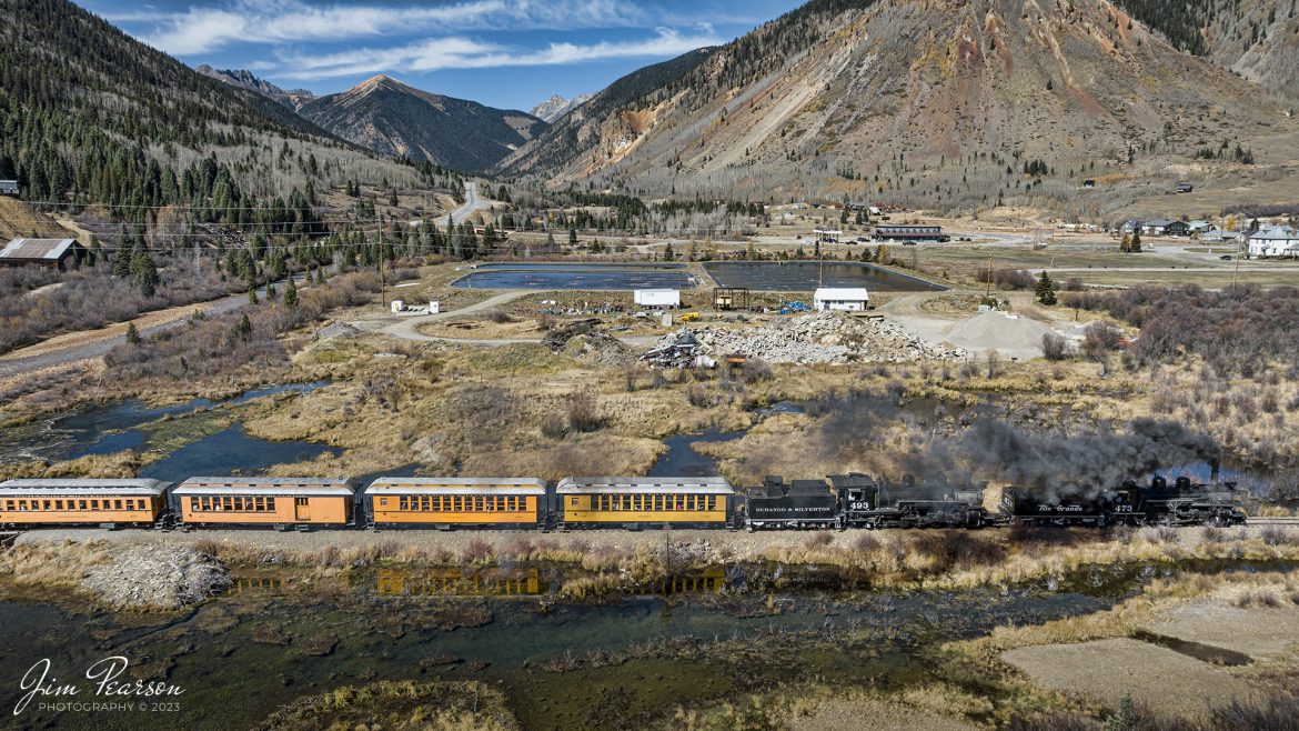 Denver and Rio Grande Western double header steam locomotives 473 and 493 pull one of several daily passenger trains, as they approach downtown Silverton, Colorado on October 18th, 2023.

According to Wikipedia: The Durango and Silverton Narrow Gauge Railroad, often abbreviated as the D&SNG, is a 3 ft (914 mm) narrow-gauge heritage railroad that operates on 45.2 mi (72.7 km) of track between Durango and Silverton, in the U.S. state of Colorado. The railway is a federally designated National Historic Landmark and was also designated by the American Society of Civil Engineers as a National Historic Civil Engineering Landmark in 1968.

Tech Info: DJI Mavic 3 Classic Drone, RAW, 22mm, f/2.8, 1/1250, ISO 400.

#railroad #railroads #train #trains #bestphoto #railroadengines #picturesoftrains #picturesofrailway #bestphotograph #photographyoftrains #trainphotography #JimPearsonPhotography #DurangoandSilvertonRailroad #trending