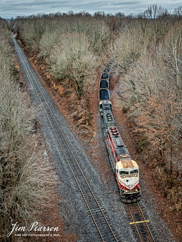 Paducah and Louisville Railway University of Louisville locomotive 2013 pulls a loaded Louisville Gas and Electric (LGE) coal train off the Warrior lead as they start their move north to the LGE power plant, just outside Louisville, Ky, on January 24th, 2024.

This engine is specially painted to honor the school’s NCAA basketball wins.

According to Wikipedia: The Paducah & Louisville Railway (reporting mark PAL) is a Class II railroad that operates freight service between Paducah and Louisville, Kentucky. The line is located entirely within the Commonwealth of Kentucky.

Tech Info: DJI Mavic 3 Classic Drone, RAW, 22mm, f/2.8, 1/320, ISO 200.

#railroad #railroads #train #trains #bestphoto #railroadengines #picturesoftrains #picturesofrailway #bestphotograph #photographyoftrains #trainphotography #JimPearsonPhotography #PaducahandLouisvilleRailway #trending