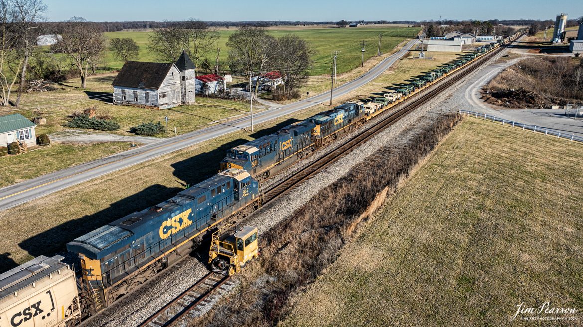 Northbound CSX 3244 leads loaded military train S279 meets loaded grain train G239 at the north end of the siding at Trenton, Kentucky, on October 5th, 2024, on the Henderson Subdivision, as they wait to deliver their military loads to the Ft. Campbell lead at Hopkinsville, Ky.

Tech Info: DJI Mavic 3 Classic Drone, RAW, 22mm, f/8, 1/2000, ISO 120.

#trainphotography #railroadphotography #trains #railways #jimpearsonphotography #trainphotographer #railroadphotographer #dronephoto #trainsfromadrone #CSX #trending