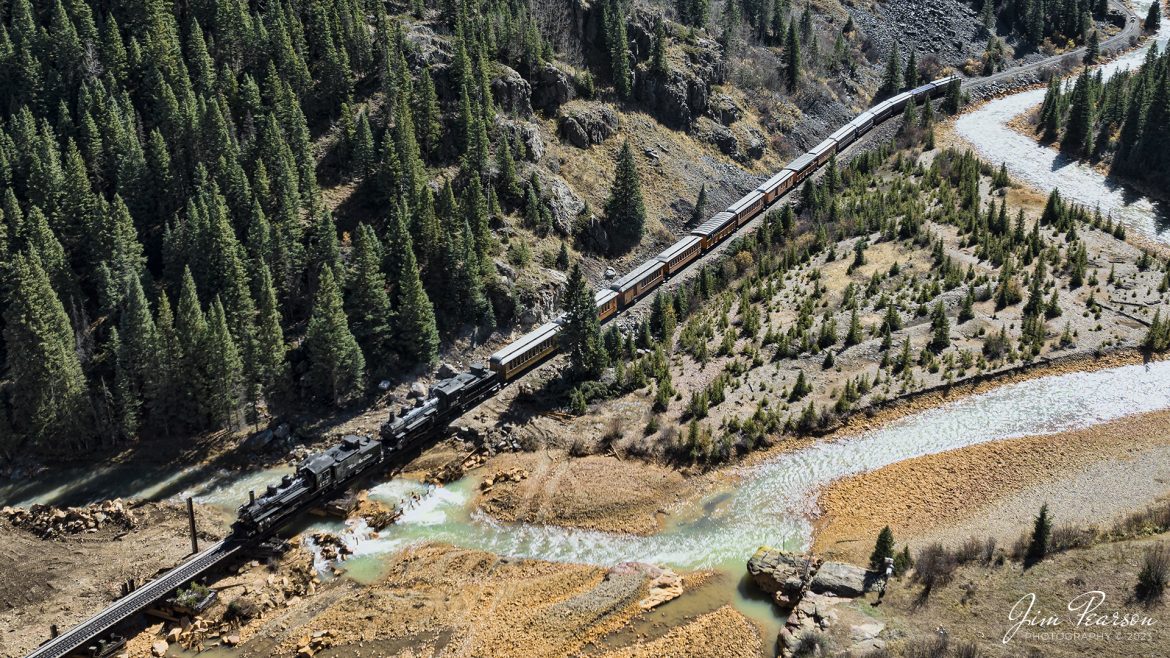 On October 18th, 2023, double-header steam locomotives, Denver and Rio Grande Western 473 and 493 pull one of the daily passenger trains across the Animas River as they head into Silverton, Colorado.

According to Wikipedia: The Durango and Silverton Narrow Gauge Railroad, often abbreviated as the D&SNG, is a 3 ft (914 mm) narrow-gauge heritage railroad that operates on 45.2 mi (72.7 km) of track between Durango and Silverton, in the U.S. state of Colorado. The railway is a federally designated National Historic Landmark and was also designated by the American Society of Civil Engineers as a National Historic Civil Engineering Landmark in 1968.

Tech Info: DJI Mavic 3 Classic Drone, RAW, 22mm, f/2.8, 1/1600, ISO 210.

#railroad #railroads #train #trains #bestphoto #railroadengines #picturesoftrains #picturesofrailway #bestphotograph #photographyoftrains #trainphotography #JimPearsonPhotography #DurangoandSilvertonRailroad #trending