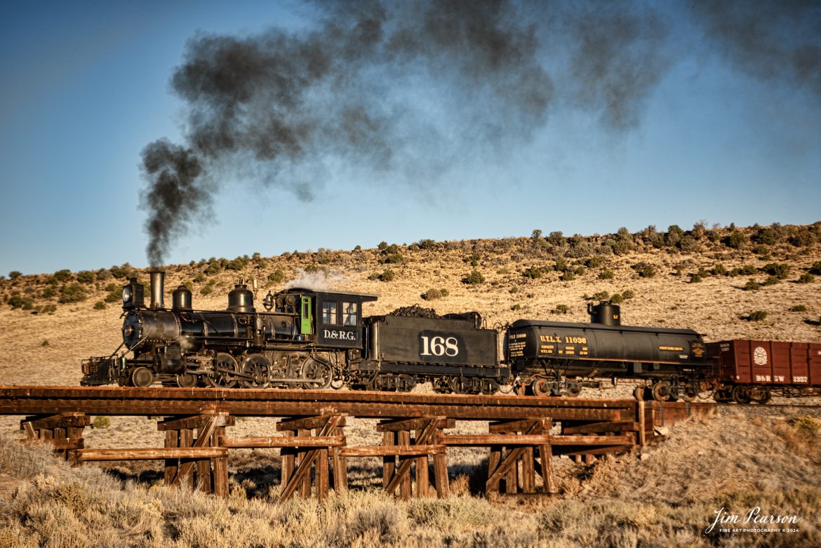 Cumbres & Toltec Scenic Railroad steam locomotive D&RGW 168 passes over Ferguson's Trestle at MP 285.87 at sunrise as it heads to Osier, Colorado, during a photo charter by Dak Dillon Photography on October 20th, 2023.

According to their website: the Cumbres & Toltec Scenic Railroad is a National Historic Landmark.  At 64-miles in length, it is the longest, the highest and most authentic steam railroad in North America, traveling through some of the most spectacular scenery in the Rocky Mountain West.

Owned by the states of Colorado and New Mexico, the train crosses state borders 11 times, zigzagging along canyon walls, burrowing through two tunnels, and steaming over 137-foot Cascade Trestle. All trains steam along through deep forests of aspens and evergreens, across high plains filled with wildflowers, and through a rocky gorge of remarkable geologic formations. Deer, antelope, elk, fox, eagles and even bear are frequently spotted on this family friendly, off-the grid adventure.

Tech Info: Nikon D810, RAW, Sigma 24-70 @ 70mm, f/3.2, 1/1000, ISO 80.

#railroad #railroads #train #trains #bestphoto #railroadengines #picturesoftrains #picturesofrailway #bestphotograph #photographyoftrains #trainphotography #JimPearsonPhotography #CumbresToltecScenicRailroad #trending