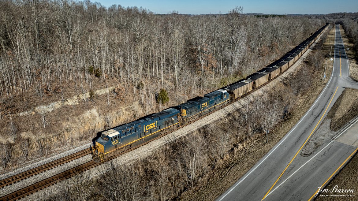 CSX 3177 leads loaded coal train, C319, as they head south out of Nortonville, Ky, on February 5th, 2024, on the Henderson Subdivision, with their train, just north of Crofton, Kentucky. 

Tech Info: DJI Mavic 3 Classic Drone, RAW, 22mm, f/2.8, 1/1600, ISO 100.

#trainphotography #railroadphotography #trains #railways #jimpearsonphotography #trainphotographer #railroadphotographer #dronephoto #trainsfromadrone #CSX #trending