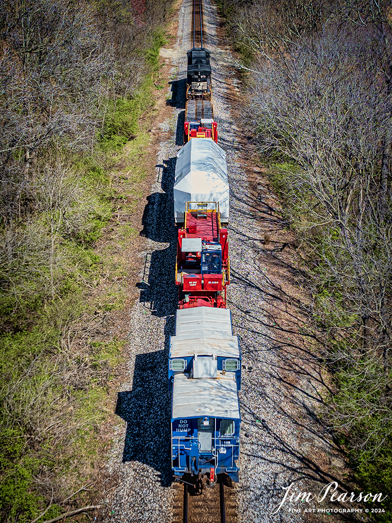 A Fracht Caboose brings up the rear on Norfolk Southern 3730 as it leads CSX S991 with an oversized Turbine load from Siemens Energy on a depressed flatbed northbound from Evansville, Indiana, on the CSX Evansville Terminal Subdivision, on March 20th, 2024. 

B229 originated at Birmingham, AL and is headed for New Castle, PA. I caught this move just north of Evansville, IN and gave chase to Patoka, Indiana. 

Tech Info: DJI Mavic 3 Classic Drone, RAW, 22mm, f/2.8, 1/1250, ISO 100.

#trainphotography #railroadphotography #trains #railways #jimpearsonphotography #trainphotographer #railroadphotographer #csxt #dronephoto #trainsfromadrone #trending #csxevansvilleterminalsubdivision #norfolksouthern #trending