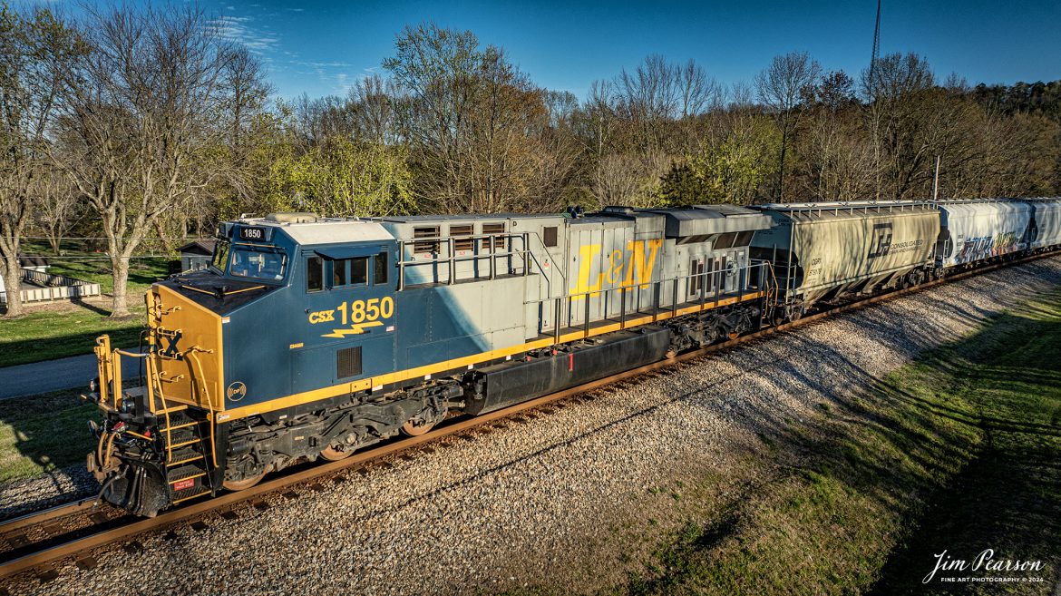 CSX M500 heads north at Mortons Gap, Kentucky, with CSX Heritage Unit, L&N 1850, on March 24th, 2024, on the Henderson Subdivision. 

According to CSXT: CSX has introduced the sixth locomotive in its heritage series, a freshly painted unit honoring the Louisville & Nashville Railroad. Designated CSX 1850, the locomotive will be placed into service, carrying the L&N colors across the 20,000-mile CSX network.

The paint scheme was designed and applied at the CSX Locomotive Shop in Waycross, Georgia, which has produced all six units in the heritage series celebrating the lines that came together to form the modern CSX. Like the other heritage locomotives, the L&N unit combines the heritage railroad’s iconic logo and colors on the rear two-thirds of the engine with today’s CSX colors and markings on the cab end.

Chartered by the State of Kentucky in 1850, the L&N grew into a vital transportation link between the Gulf Coast and the nation’s heartland. The railroad was absorbed by the Seaboard Coastline Railroad, which subsequently became part of the Chessie System and, ultimately, today’s CSX.

The CSX heritage series is reinforcing employee pride in the history of the railroad that continues to move the nation’s economy with safe, reliable and sustainable rail-based transportation services.

Tech Info: DJI Mavic 3 Classic Drone, RAW, 22mm, f/2.8, 1/1600, ISO 110.

#railroad #railroads #train #trains #bestphoto #railroadengines #picturesoftrains #picturesofrailway #bestphotograph #photographyoftrains #trainphotography #JimPearsonPhotography #csxheritageunit #tending