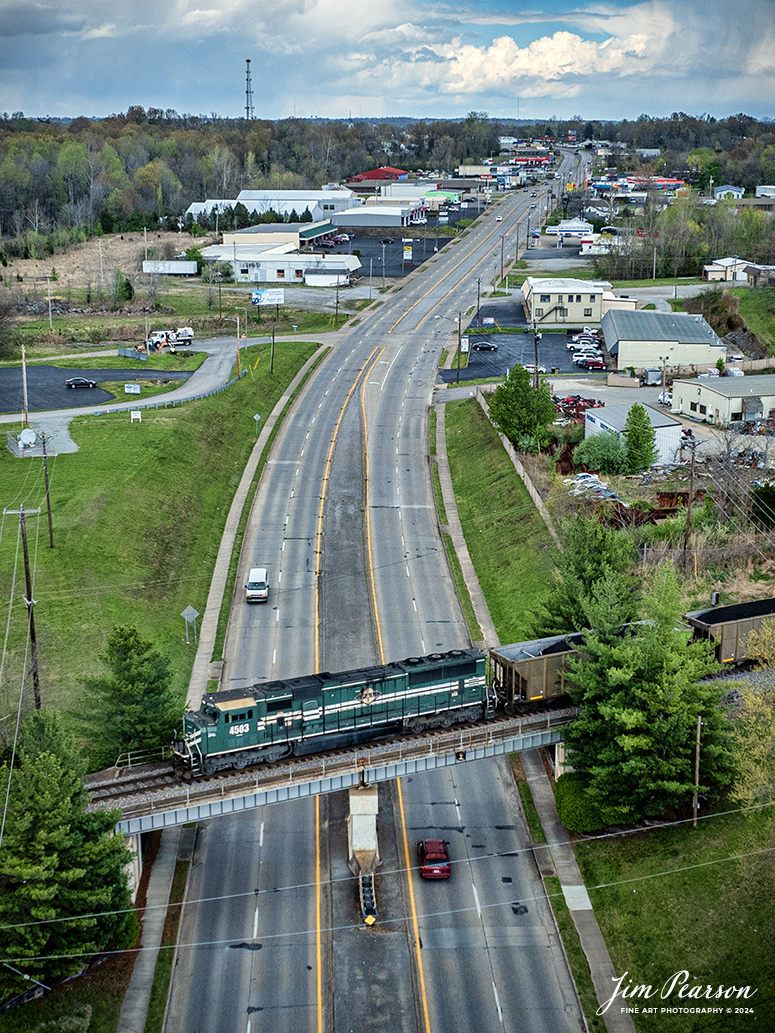 Paducah and Louisville Railway 4503 brings up the rear as DPU on a loaded Louisville Gas and Electric coal train as they pass over south Main Street in Madisonville, Ky, as they head north to the LGE power plant, just outside of Louisville, Ky, on April 3rd, 2024.

According to Wikipedia: The Paducah & Louisville Railway (reporting mark PAL) is a Class II railroad that operates freight service between Paducah and Louisville, Kentucky. The line is located entirely within the Commonwealth of Kentucky. The 270-mile (430 km) line was purchased from Illinois Central Gulf Railroad in August 1986.

Tech Info: DJI Mavic 3 Classic Drone, RAW, 22mm, f/2.8, 1/1000, ISO 240.

#trainphotography #railroadphotography #trains #railways #jimpearsonphotography #trainphotographer #railroadphotographer #csxt #dronephoto #trainsfromadrone #trending #csxhendersonsubdivision #palrailway #paducahandlouisvillerailway #trainsfromadrone