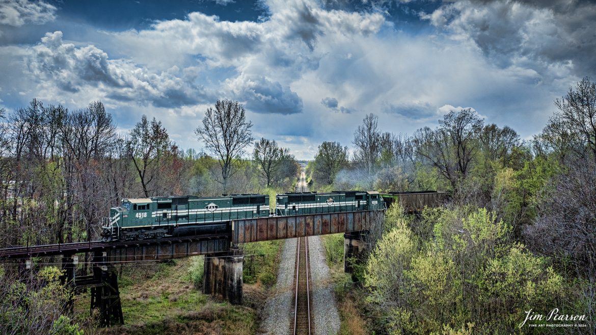 Paducah and Louisville Railway 4518 and 4516 lead a loaded Louisville Gas and Electric coal train over the CSX Henderson Subdivision at the location called Monarch in Madisonville, Ky, as they head north to the LGE power plant, just outside of Louisville, Ky, on April 3rd, 2024.

According to Wikipedia: The Paducah & Louisville Railway (reporting mark PAL) is a Class II railroad that operates freight service between Paducah and Louisville, Kentucky. The line is located entirely within the Commonwealth of Kentucky. The 270-mile (430 km) line was purchased from Illinois Central Gulf Railroad in August 1986.

Tech Info: DJI Mavic 3 Classic Drone, RAW, 22mm, f/2.8, 1/3200, ISO 140.

#trainphotography #railroadphotography #trains #railways #jimpearsonphotography #trainphotographer #railroadphotographer #csxt #dronephoto #trainsfromadrone #trending #csxhendersonsubdivision #palrailway #paducahandlouisvillerailway #trainsfromadrone