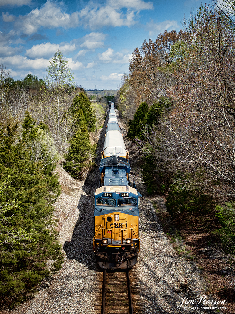 CSXT 3316 leads CSX hot intermodal I025 southbound as it approaches Mortons Junction at Mortons Gap, Ky, on April 10th, 2024. The long string of Autoracks behind the power on this train are filled with Tesla’s bound for Florida, where I’m told, they will head to overseas markets.

Tech Info: DJI Mavic 3 Classic Drone, RAW, 22mm, f/2.8, 1/1600, ISO 100.