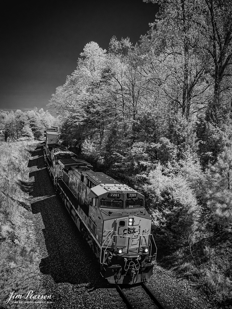 In this week’s Saturday Infrared Photo, we catch CSXT 7201 as it leads hot intermodal I025 south through the cut approaching the Cavanaugh Road overpass just north of Kelly, Kentucky, on April 13th, 2024, on the Henderson Subdivision.

Tech Info: Fuji XT-1, RAW, Converted to 720nm B&W IR, Nikon 10-24 @ 20mm, f/5.6, 1/450, ISO 400.
