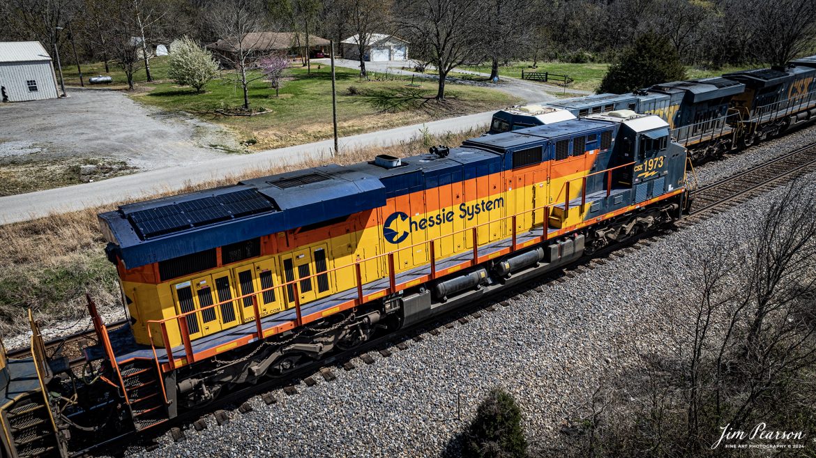 CSXT 1973, Chessie System Heritage Unit, leads CSX M647 as it meets M512 in the siding at Kelly, Ky, as M647 continues south on the CSX Henderson Subdivision, on December 22, 2023. The Henderson Subdivision has seen a lot of CSX Heritage units the last week or so and hopefully there’ll be more in the future so I can capture and share them with you! I’ll be posting some videos of these moves in future Saturday Edited Videos so keep an eye out for them!

According to Wikipedia: The three railroads that would make up the Chessie System had been closely related since the 1960s. C&O had acquired controlling interest in B&O in 1962, and the two had jointly controlled WM since 1967.

Chessie System, Inc. was a holding company that owned the Chesapeake and Ohio Railway (C&O), the Baltimore and Ohio Railroad (B&O), the Western Maryland Railway (WM), and Baltimore and Ohio Chicago Terminal Railroad (B&OCT). Trains operated under the Chessie name from 1973 to 1987.

On November 1, 1980, Chessie System merged with Seaboard Coastline Industries to form CSX Corporation. Initially, the three Chessie System railroads continued to operate separately, even after Seaboard’s six Family Lines System railroads were merged into the Seaboard System Railroad on December 29, 1982. That began to change in 1983, when the WM was merged into the B&O. The Chessie image continued to be applied to new and re-painted equipment until July 1, 1986, when CSXT introduced its own paint scheme. In April 1987, the B&O was merged into the C&O. In August 1987, C&O merged into CSX Transportation, a 1986 renaming of the Seaboard System Railroad, and the Chessie System name was retired.

Tech Info: DJI Mavic 3 Classic Drone, RAW, 22mm, f/2.8, 1/1600, ISO 100.

#trainphotography #railroadphotography #trains #railways #jimpearsonphotography #trainphotographer #railroadphotographer #csxt #dronephoto #trainsfromadrone #csx #csxheritageunit #trending