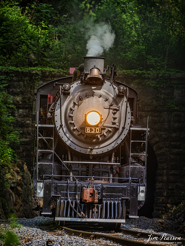 Tennessee Valley Railroad Museum’s steam locomotive Southern Railway 630 exits Missionary Ridge Tunnel as it approaches East Chattanooga, Tennessee with a trainload of passengers, on April 27th, 2024. 

According to Wikipedia: Southern Railway 630 is a 2-8-0 "Consolidation" type steam locomotive built in February 1904 by the American Locomotive Company (ALCO) of Richmond, Virginia for the Southern Railway as a member of the Ks-1 class. It is currently owned and operated by the Tennessee Valley Railroad Museum in Chattanooga, Tennessee where it resides today for use on excursion trains.

According to the Tennessee River Valley Tourism site: Tennessee Valley Railroad Museum's passenger trains run on an historic route which includes Missionary Ridge Tunnel, completed in 1858 and on the National Register of Historic Places. The tunnel is the primary reason TVRM runs on the three-mile section of the former Southern Railway. As railroad equipment grew too large to pass through, the single-track tunnel became a traffic jam for an other wise double-track railroad. Southern Railway abandoned the three-mile portion of the line and built a new section around the end of Missionary Ridge, avoiding the tunnel altogether. TVRM restored rails through the tunnel in 1971 and continues to use the pre-Civil War Tunnel daily.

Tech Info: Nikon D800, Sigma 150-600 @ 280mm, f/5.6, 1/320, ISO 320.

#trainphotography #railroadphotography #trains #railways #trainphotographer #railroadphotographer #jimpearsonphotography #PassengerTrain #TennesseeValleyRailroadMuseum #TennesseeTrains #steamtrain #tvrm