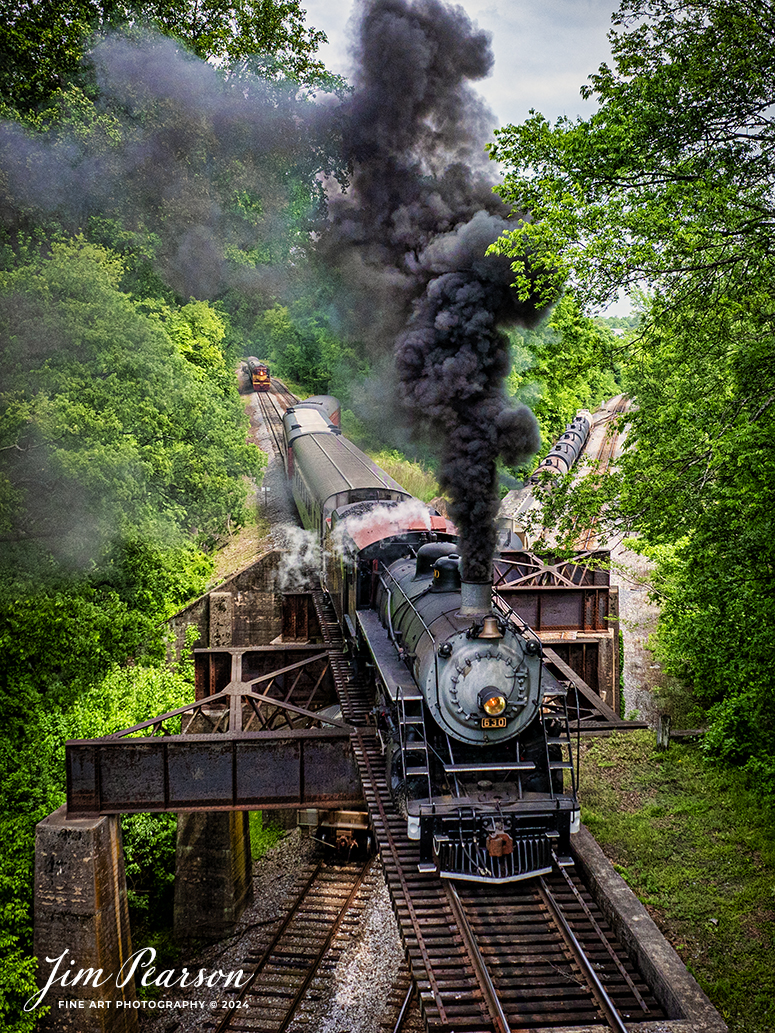 Tennessee Valley Railroad Museum’s steam locomotive Southern Railway 630 crosses over the CSX W&A Subdivision as it heads to East Chattanooga, Tennessee with a trainload of passengers, on April 27th, 2024. 
According to Wikipedia: Southern Railway 630 is a 2-8-0 "Consolidation" type steam locomotive built in February 1904 by the American Locomotive Company (ALCO) of Richmond, Virginia for the Southern Railway as a member of the Ks-1 class. It is currently owned and operated by the Tennessee Valley Railroad Museum in Chattanooga, Tennessee where it resides today for use on excursion trains.

The Tennessee Valley Railroad Museum was founded as a chapter of the National Railway Historical Society in 1960 by Paul H. Merriman and Robert M. Soule, Jr., along with a group of local railway preservationists. They wanted to save steam locomotives and railway equipment for future historical display and use. Today, the museum offers various tourist excursions from stations in Chattanooga and Etowah, Tennessee.

Tech Info: DJI Mavic 3 Classic Drone, RAW, 24mm, f/2.8, 1/500, ISO 150.

#trainphotography #railroadphotography #trains #railways #trainphotographer #railroadphotographer #jimpearsonphotography #PassengerTrain #TennesseeValleyRailroadMuseum #TennesseeTrains #steamtrain #tvrm