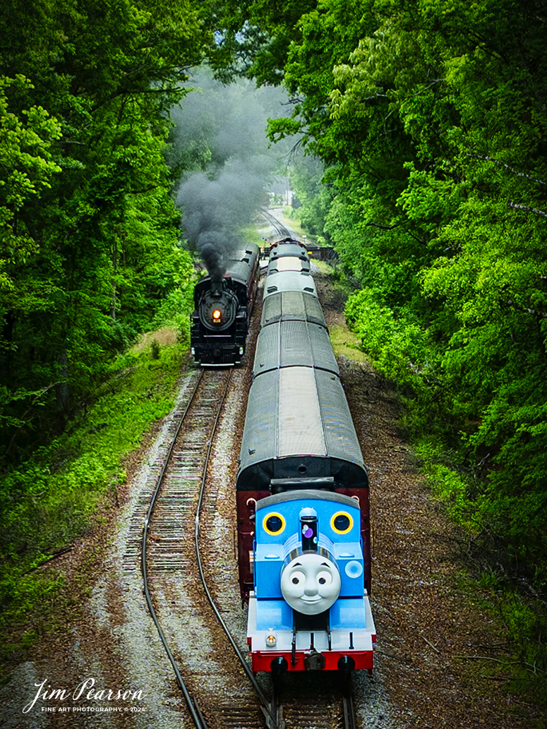 The Iconic Thomas the Tank Engine sits on the main waiting for Southern Railroad 630 to clear the switch at the siding just before the Chickamauga Creek Bridge his train can proceed toward East Chattanooga, Tennessee, on April 27th, 2024.

According to Wikipedia: Thomas the Tank Engine is an anthropomorphised fictional tank locomotive in the British Railway Series books by Wilbert Awdry and his son, Christopher, published from 1945. He became the most popular and famous character in the series, and is the titular protagonist in the accompanying television adaptation series Thomas & Friends and its reboot Thomas & Friends: All Engines Go.

All of the vehicles in The Railway Series were based on prototypical engines; Thomas's basis is the LB&SCR E2 class. Thomas first appeared in 1946 in the second book in the series, Thomas the Tank Engine, and was the focus of the four short stories contained within. In The Railway Series and early episodes of Thomas & Friends, Thomas's best friends are Percy and Toby, though he is also close friends with Edward. Later episodes of Thomas & Friends have Thomas in a trio with James and Percy, and Percy is known as his best friend.

In 1979, British writer and producer Britt Allcroft came across the books, and arranged a deal to bring the stories to life as the TV series Thomas the Tank Engine & Friends (later simplified to Thomas & Friends). The programme became an award-winning hit around the world, with a vast range of spin-off commercial products.

Thomas now travels the world to delight children of all ages!

Tech Info: DJI Mavic 3 Classic Drone, RAW, 24mm, f/2.8, 1/400, ISO 100.