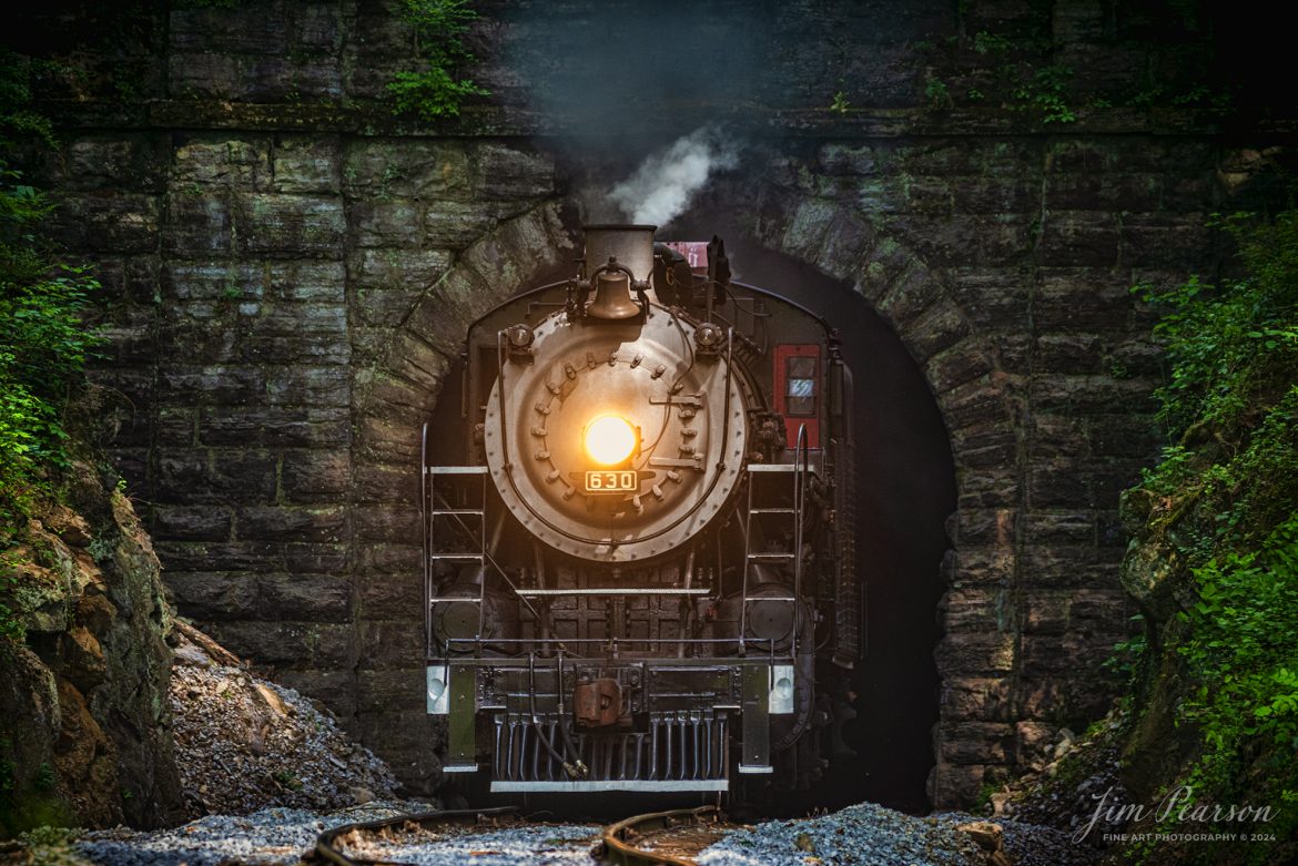 Tennessee Valley Railroad Museum’s steam locomotive Southern Railway 630 exits Missionary Ridge Tunnel as it approaches East Chattanooga, Tennessee with a trainload of passengers, on April 27th, 2024. 

According to Wikipedia: Southern Railway 630 is a 2-8-0 "Consolidation" type steam locomotive built in February 1904 by the American Locomotive Company (ALCO) of Richmond, Virginia for the Southern Railway as a member of the Ks-1 class. It is currently owned and operated by the Tennessee Valley Railroad Museum in Chattanooga, Tennessee where it resides today for use on excursion trains.

According to the Tennessee River Vally Tourism site: Tennessee Valley Railroad Museum's passenger trains run on an historic route which includes Missionary Ridge Tunnel, completed in 1858 and on the National Register of Historic Places. The tunnel is the primary reason TVRM runs on the three-mile section of the former Southern Railway. As railroad equipment grew too large to pass through, the single-track tunnel became a traffic jam for an other wise double-track railroad. Southern Railway abandoned the three-mile portion of the line and built a new section around the end of Missionary Ridge, avoiding the tunnel altogether. TVRM restored rails through the tunnel in 1971 and continues to use the pre-Civil War Tunnel daily.

Tech Info: Nikon D800, Sigma 150-600 @ 390mm, f/6, 1/250, ISO 1000.

#trainphotography #railroadphotography #trains #railways #trainphotographer #railroadphotographer #jimpearsonphotography #PassengerTrain #TennesseeValleyRailroadMuseum #TennesseeTrains #steamtrain #tvrm