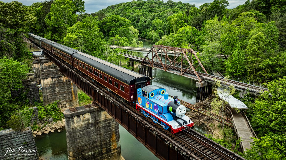 The Iconic Thomas the Tank Engine leads a passenger train over the Chickamauga Creek Bridge as it heads to Grand Junction at West Chattanooga, Tennessee, on April 27th, 2024.

According to Wikipedia: Thomas the Tank Engine is an anthropomorphised fictional tank locomotive in the British Railway Series books by Wilbert Awdry and his son, Christopher, published from 1945. He became the most popular and famous character in the series, and is the titular protagonist in the accompanying television adaptation series Thomas & Friends and its reboot Thomas & Friends: All Engines Go.

All of the vehicles in The Railway Series were based on prototypical engines; Thomas's basis is the LB&SCR E2 class. Thomas first appeared in 1946 in the second book in the series, Thomas the Tank Engine, and was the focus of the four short stories contained within. In The Railway Series and early episodes of Thomas & Friends, Thomas's best friends are Percy and Toby, though he is also close friends with Edward. Later episodes of Thomas & Friends have Thomas in a trio with James and Percy, and Percy is known as his best friend.

In 1979, British writer and producer Britt Allcroft came across the books, and arranged a deal to bring the stories to life as the TV series Thomas the Tank Engine & Friends (later simplified to Thomas & Friends). The programme became an award-winning hit around the world, with a vast range of spin-off commercial products.

Thomas now travels the world to delight children of all ages!

Tech Info: Nikon D800, Nikon 10-24 @ 19mm, f/6.3, 1/800, ISO 100.