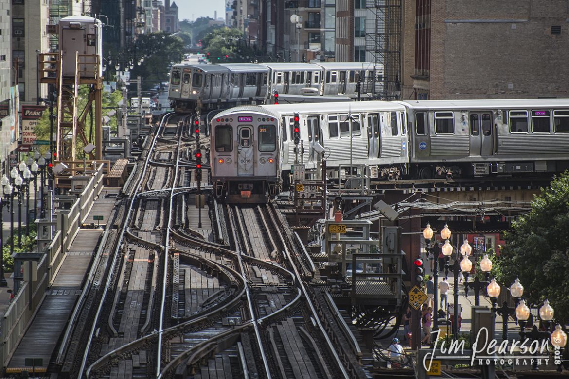 September 2, 2018 - A CTA pink line train takes a right at Tower 12 as another train rounds a curve heading into the interlocking in downtown Chicago, Illinois. - #jimstrainphotos #illinoisrailroads #trains #nikond800 #railroad #railroads #train #railways #railway #cta #thechicagol #chicago