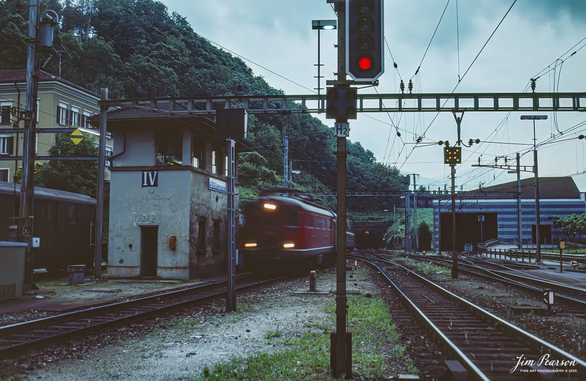 Film Wednesday – 1993 – Today’s slide scan is from a trip I took between Aviano, Italy and Zermatt, Switzerland. Here I caught a train arriving at the station in Bellinzona, Switzerland on the way to Zermatt.

According to Wikipedia: The Glacier Express is a direct Panorama Express (PE) train connecting railway stations of the two major mountain resorts of Zermatt and St. Moritz via Andermatt in the central Swiss Alps. The train provides a one-seat ride for an 8-hour end-to-end 291-kilometre (181 mi) journey, and omits stops made by local trains. The Glacier Express has been called the 'slowest express train in the world'. As St. Moritz and Zermatt are home to two well-known mountains, the Glacier Express is also said to travel from Matterhorn to Piz Bernina.

Tech Info: Camera, Nikon F3, Kodachrome Slide Film, no other data recorded, Scanned with a PlusTek 82001i Film Scanner.

#slidescan #filmphotography #trains #railroads #jimpearsonphotography #FilmPhotography