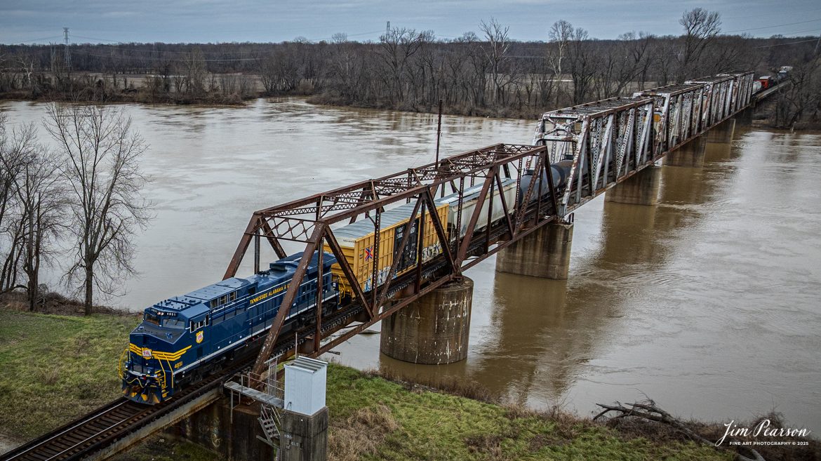 I spent New Year’s Day with fellow railfan Ryan Scott and we spent it chasing Norfolk Southern’s newest Heritage Unit, Tennessee, Alabama & Georgia Railway locomotive 4851 as it ran as the DPU on NS 167 On January 1st, 2025. Here the TAG locomotive prepares to pass over the Wabash river at Mt. Carmel, IL on their move east.

Norfolk Southern recently unveiled their newest addition to their Heritage Fleet: the Tennessee, Alabama & Georgia Railway locomotive!

“Once a vital link between Chattanooga and Gadsden, the TAG Railway played a key role in moving coal, steel, and more. Its legacy is now proudly reflected in our fleet.”

Tech Info: DJI Mavic 3 Classic Drone, RAW, 24mm, f/2.8, 1/400, ISO 120.

#railroad #railroads #train, #trains #railway #railway #railtransport #railroadengines #picturesoftrains #picturesofrailways #besttrainphotograph #bestphoto #photographyoftrains #bestsoldpicture #JimPearsonPhotography #trainsfromadrone #nsheritagelocomotives #NSTAGlocomotive