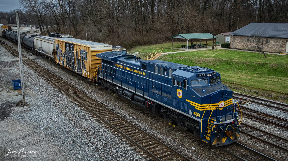 I spent New Year’s Day with fellow railfan Ryan Scott and we spent it chasing Norfolk Southern’s newest Heritage Unit, Tennessee, Alabama & Georgia Railway locomotive 4851 as it ran as the DPU on NS 167 On January 1st, 2025. Here the TAG locomotive sits next to he NS office at Princeton, Indiana as the train gets a recrew on the headend.

Norfolk Southern recently unveiled their newest addition to their Heritage Fleet: the Tennessee, Alabama & Georgia Railway locomotive!

“Once a vital link between Chattanooga and Gadsden, the TAG Railway played a key role in moving coal, steel, and more. Its legacy is now proudly reflected in our fleet.”

Tech Info: DJI Mavic 3 Classic Drone, RAW, 24mm, f/2.8, 1/500, ISO 130.

#railroad #railroads #train, #trains #railway #railway #railtransport #railroadengines #picturesoftrains #picturesofrailways #besttrainphotograph #bestphoto #photographyoftrains #bestsoldpicture #JimPearsonPhotography #trainsfromadrone #nsheritagelocomotives #NSTAGlocomotive