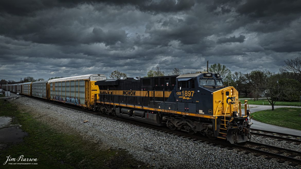 CSX I025 heads south at Crofton, Kentucky as CSX Monon Heritage Unit 1897 leads it under dark threatening skies on April 2nd, 2025, on the CSX Henderson Subdivision. The eleven autoracks behind the engine are loaded with Tesla’s bound for Florida and overseas market from what I’m told.

Capturing this engine means I’ve caught all of CSX’s Heritage units except for the Georgia Heritage Unit, and that one is only a matter of time!

According to a CSX Press Release: January 26, 2024 - In a tribute to its rich railroad history, CSX has unveiled its Monon 1897 heritage locomotive, marking the ninth release its ongoing heritage series honoring the company's predecessor railroads.

“The Monon Railroad ran from Chicago down to Louisville but most of it was in Indiana,” explained CSX Carman Jason Merritt, who assisted with the heritage project. “Eventually it merged with the Louisville and Nashville Lines and was later absorbed by CSX.”

The new heritage locomotive emerges fresh from the Class I railroad's paint shop in Waycross, Ga., showcasing a blend of modern and historic aesthetics. The design features the modern CSX design on the head end, transitioning seamlessly into the historic paint scheme and logo of the Monon line. This style reflects the approach taken with previous installations in the CSX heritage series, which often feature the current CSX paint scheme on the nose and the predecessor's scheme on the body.

Tech Info: DJI Mavic 3 Classic Drone, RAW, 22mm, f/2.8, 1/2000, ISO 110.

#railroad #railroads #train, #trains #railway #railway #railtransport #railroadengines #picturesoftrains #picturesofrailways #besttrainphotograph #bestphoto #photographyoftrains #bestsoldpicture #JimPearsonPhotography #trainsfromadrone #csxhendersonsubdivision #onecsx #csxheritageunit