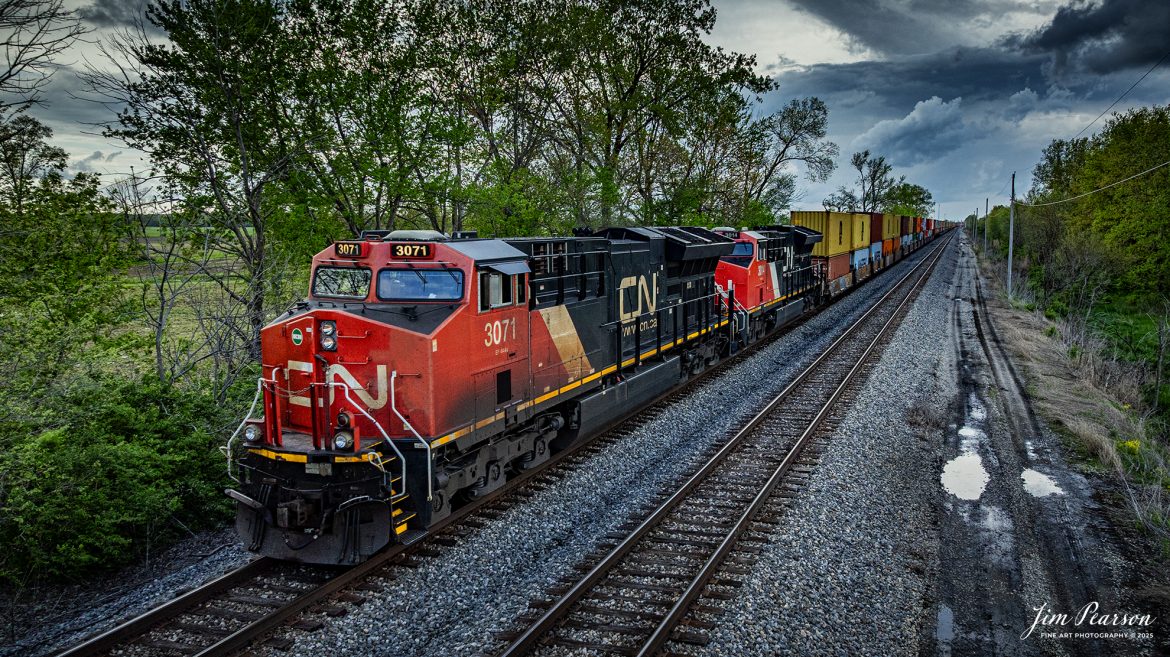 A southbound Canadian National intermodal waits to depart on the main from the south end of Effingham, Illinois on the CN Champagne Subdivision, on April 25th, 2025, under stormy skies.

Tech Info: DJI Mavic 3 Classic Drone, RAW, 24mm, f/2.8, 1/1000, ISO 370.

#railroad #railroads #train, #trains #railway #railway #railtransport #railroadengines #picturesoftrains #picturesofrailways #besttrainphotograph #bestphoto #photographyoftrains #bestsoldpicture #JimPearsonPhotography #trainsfromadrone #unionpacificrailway