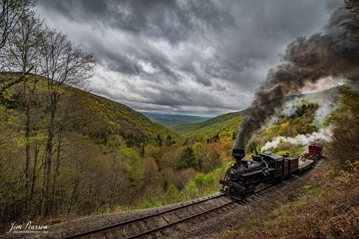 Cass Scenic Railroad Heisler #6 pulls through the curve at Old Spruce Overlook under stormy skies during the Cass Spring Photographers Special, out of Cass, West Virginia on May 3rd, 2025. 

According to the Mountain Rail West Virginia Website: The Meadow River Lumber No. 6 was built by the Heisler Locomotive Works in Erie, PA, in 1929 for the Bostonia Coal & Clay Products Company of New Bethlehem, PA.

The Heisler was sold to the Meadow River Lumber Company at Rainelle, WV in 1939, where it was rostered as No. 6. She retired from the lumber company in 1965 and purchased by the State of West Virginia. The engine ran under its own steam from Rainelle to its new home in Cass in December 1966. No. 6 would begin operating on the railroad in 1968. The Heisler is the fastest geared locomotive in the Cass collection.

Tech Info: Nikon Z6ii, RAW, Nikon 10-24 @ 24mm, f/6.3, 1/640, ISO 100.

#railroad #railroads #train, #trains #railway #railway #steamtrains #railtransport #railroadengines #picturesoftrains #picturesofrailways #besttrainphotograph #bestphoto #photographyoftrains #bestsoldpicture #JimPearsonPhotography #steamtrains #cassscenicrailway