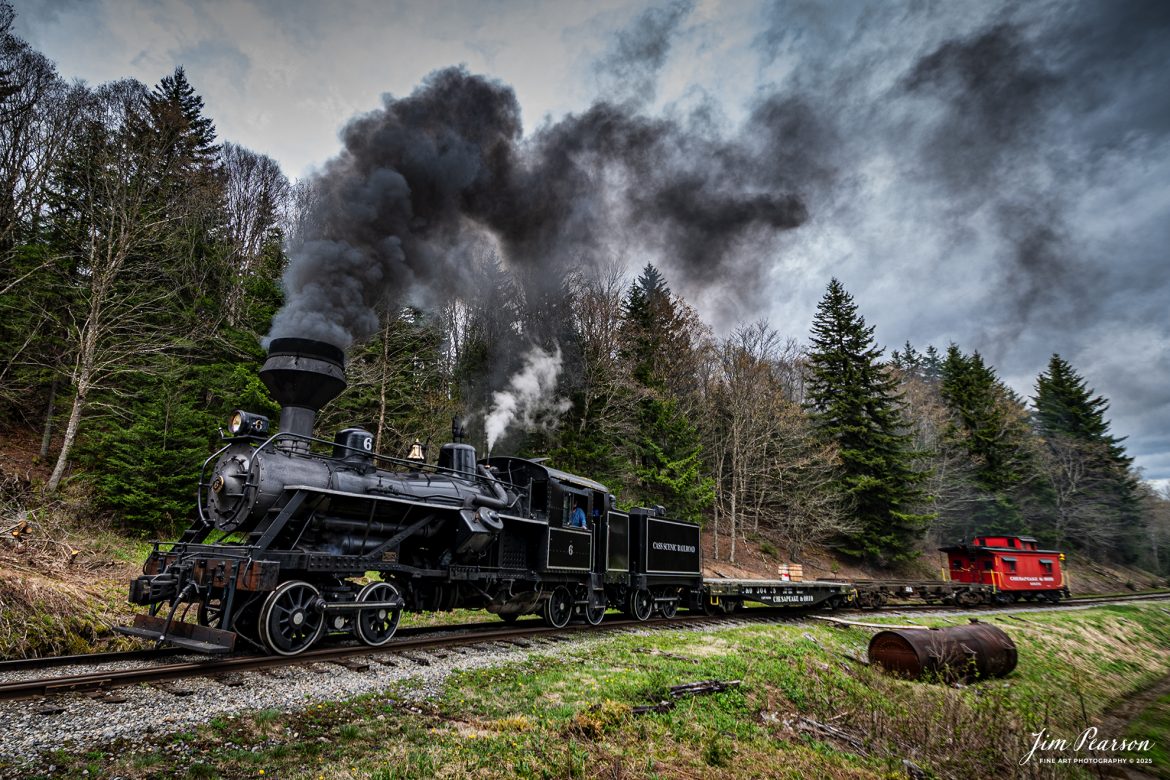Cass Scenic Railroad Heisler #6 pulls up hill past the emergency water tank as they head for Bald Knob, WV during the Cass Spring Photographers Special, from Cass, West Virginia on May 3rd, 2025. 

According to the Mountain Rail West Virginia Website: The Meadow River Lumber No. 6 was built by the Heisler Locomotive Works in Erie, PA, in 1929 for the Bostonia Coal & Clay Products Company of New Bethlehem, PA.

The Heisler was sold to the Meadow River Lumber Company at Rainelle, WV in 1939, where it was rostered as No. 6. She retired from the lumber company in 1965 and was purchased by the purchased it by the state of West Virginia purchased. The engine ran under its own steam from Rainelle to its new home in Cass in December 1966. No. 6 would begin operating on the railroad in 1968. The Heisler is the fastest geared locomotive in the Cass collection.

Tech Info: Nikon Z6ii, RAW, Nikon 10=24@ 24mm, f/3.5, 1/640, ISO 100.

#railroad #railroads #train, #trains #railway #railway #railtransport #railroadengines #picturesoftrains #picturesofrailways #besttrainphotograph #bestphoto #photographyoftrains #bestsoldpicture #JimPearsonPhotography #steamtrain #casssenicrailroad