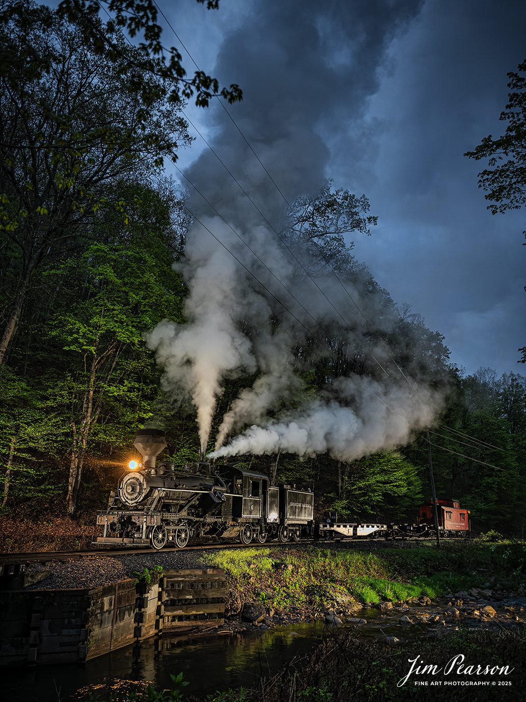 Cass Scenic Railroad Heisler #6 pulls across the bridge in a light rain at Leatherbark Creek during a night photo shoot as part of the Cass Spring Photographers Special, at Cass, West Virginia on May 3rd, 2025. 

According to the Mountain Rail West Virginia Website: The Meadow River Lumber No. 6 was built by the Heisler Locomotive Works in Erie, PA, in 1929 for the Bostonia Coal & Clay Products Company of New Bethlehem, PA.

The Heisler was sold to the Meadow River Lumber Company at Rainelle, WV in 1939, where it was rostered as No. 6. She retired from the lumber company in 1965 and was purchased by the purchased it by the state of West Virginia purchased. The engine ran under its own steam from Rainelle to its new home in Cass in December 1966. No. 6 would begin operating on the railroad in 1968. The Heisler is the fastest geared locomotive in the Cass collection.

Tech Info: Nikon Z6ii, RAW, Nikon 24-70 @ 24mm, f/2.8, 1/125, ISO 5,600.

#railroad #railroads #train, #trains #railway #railway #railtransport #railroadengines #picturesoftrains #picturesofrailways #besttrainphotograph #bestphoto #photographyoftrains #bestsoldpicture #JimPearsonPhotography #steamtrain #casssenicrailroad