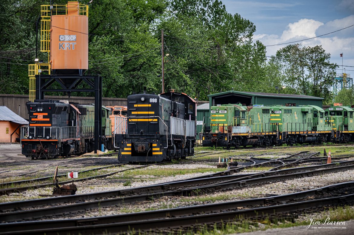 It was a quiet day at the Kanawah River Terminal Railroad during my visit there on May 1st, 2025, at Ceredo, West Virginia, but I shot this interesting shot of power sitting in the yard. 

According to their website: The Kanawha River Terminal Railroad is a switching operation serving the Kanawha River Terminal (Ceredo Dock) facility, situated along the Ohio River and is west of Huntington, West Virginia. The railroad operation handles interchange with Norfolk Southern and CSK Transportation.

The terminal has an annual throughput capacity of nearly 20 million tons and is equipped with a rotary dumper and a barge loader, the latter of which provides volume coal loading to barges. The facility and the switching railroad are owned by SunCoke Energy. A variety of first and second-generation motive power is maintained at an engine house in Ceredo, West Virginia, adjacent to the terminal.

Tech Info: Nikon Z6ii, RAW, Nikon 70-300 @ 155mm, f/4, 1/1250, ISO 640.

#railroad #railroads #train, #trains #railway #railway #railtransport #railroadengines #picturesoftrains #picturesofrailways #besttrainphotograph #bestphoto #photographyoftrains #bestsoldpicture #JimPearsonPhotography