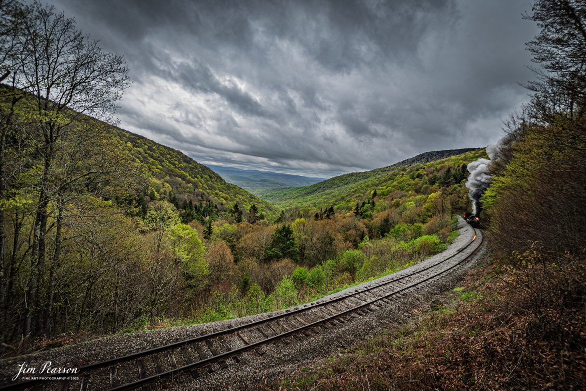 Cass Scenic Railway Heisler #6 pulls through the curve at Old Spruce Overlook under stormy skies during the Cass Spring Photographers Special, out of Cass, West Virginia on May 3rd, 2025. 

According to the Mountain Rail West Virginia Website: The Meadow River Lumber No. 6 was built by the Heisler Locomotive Works in Erie, PA, in 1929 for the Bostonia Coal & Clay Products Company of New Bethlehem, PA.

The Heisler was sold to the Meadow River Lumber Company at Rainelle, WV in 1939, where it was rostered as No. 6. She retired from the lumber company in 1965 and purchased by the State of West Virginia. The engine ran under its own steam from Rainelle to its new home in Cass in December 1966. No. 6 would begin operating on the railroad in 1968. The Heisler is the fastest geared locomotive in the Cass collection.

Tech Info: Nikon Z6ii, RAW, Nikon 10-24 @ 10mm, f/6.3, 1/640, ISO 100.

#railroad #railroads #train, #trains #railway #railway #steamtrains #railtransport #railroadengines #picturesoftrains #picturesofrailways #besttrainphotograph #bestphoto #photographyoftrains #bestsoldpicture #JimPearsonPhotography #steamtrains #cassscenicrailway