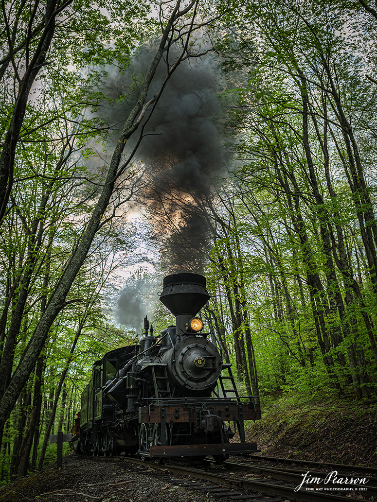 Cass Scenic Railway Heisler #6 passes the first switchback on the way to Whittaker during the Cass Spring Photographers Special, out of Cass, West Virginia on May 3rd, 2025. 

According to the Mountain Rail West Virginia Website: The Meadow River Lumber No. 6 was built by the Heisler Locomotive Works in Erie, PA, in 1929 for the Bostonia Coal & Clay Products Company of New Bethlehem, PA.

The Heisler was sold to the Meadow River Lumber Company at Rainelle, WV in 1939, where it was rostered as No. 6. She retired from the lumber company in 1965 and purchased by the State of West Virginia. The engine ran under its own steam from Rainelle to its new home in Cass in December 1966. No. 6 would begin operating on the railroad in 1968. The Heisler is the fastest geared locomotive in the Cass collection.

Tech Info: Nikon Z6ii, RAW, Nikon 24-70 @ 24mm, f/4, 1/640, ISO 220.

#railroad #railroads #train, #trains #railway #railway #steamtrains #railtransport #railroadengines #picturesoftrains #picturesofrailways #besttrainphotograph #bestphoto #photographyoftrains #bestsoldpicture #JimPearsonPhotography #steamtrains #cassscenicrailway