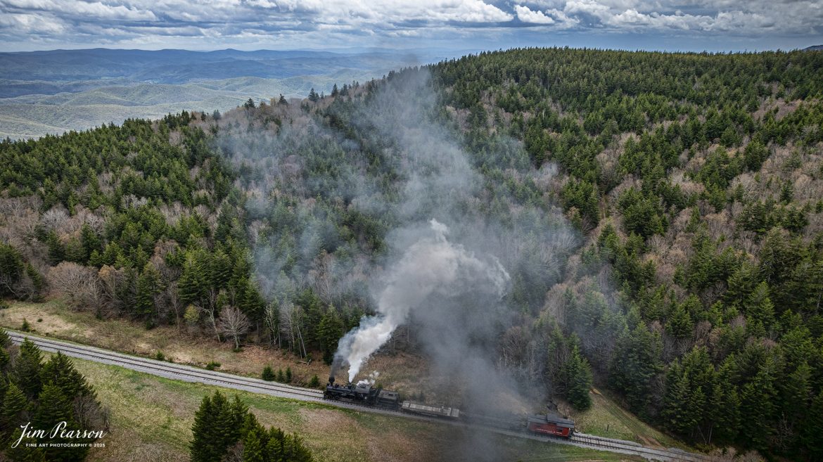 Cass Scenic Railroad Heisler#6 pulls up the hill approaching Bald Knob, WV during the Cass Spring Photographers Special, from Cass, West Virginia on May 3rd, 2025. 

According to the Mountain Rail West Virginia Website: The Meadow River Lumber No. 6 was built by the Heisler Locomotive Works in Erie, PA, in 1929 for the Bostonia Coal & Clay Products Company of New Bethlehem, PA.

The Heisler was sold to the Meadow River Lumber Company at Rainelle, WV in 1939, where it was rostered as No. 6. She retired from the lumber company in 1965 and was purchased by the purchased it by the state of West Virginia purchased. The engine ran under its own steam from Rainelle to its new home in Cass in December 1966. No. 6 would begin operating on the railroad in 1968. The Heisler is the fastest geared locomotive in the Cass collection.

Tech Info: DJI Mavic 3 Classic Drone, RAW, 24mm, f/2.8, 1/2500, ISO 280.

#railroad #railroads #train, #trains #railway #railway #steamtrains #railtransport #railroadengines #picturesoftrains #picturesofrailways #besttrainphotograph #bestphoto #photographyoftrains #bestsoldpicture #JimPearsonPhotography #trainsfromtheair #trainsfromadrone #steamtrain #casssenicrailway